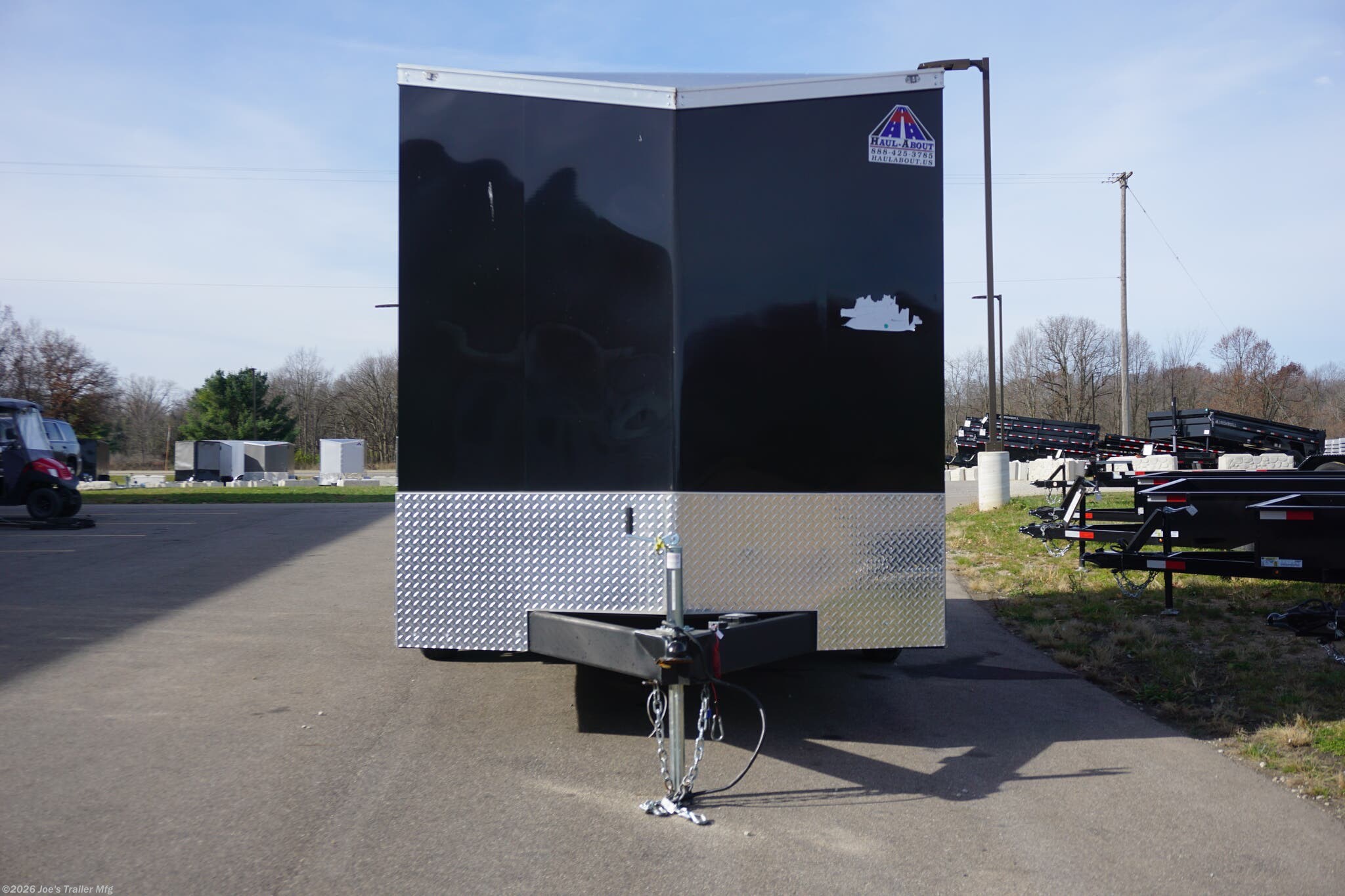 Haul-About 75” x 16’ enclosed trailer, 75” x 16’ trailer, Haul-About aluminum enclosed trailer, dual axle trailer, 2 x 3,500 lb axle trailer, aluminum cargo trailer, bumper pull enclosed trailer, black enclosed trailer, ST205/75R15 trailer tires, 15-inch trailer rims, electric brake trailer, 7,000 lb GVWR trailer, 4,314 lb payload trailer, 2,686 lb curb weight trailer, 75” wide trailer, 16’ long trailer, LED trailer lights, outside LED light with side door switch, 2,000 lb capacity D-rings, recessed floor D-rings, trailer with recessed D-rings, scoop vents trailer, trailer with flush lock, bar lock and flush lock, trailer with flip-up door, UTV trailer, enclosed UTV trailer, trailer for UTV