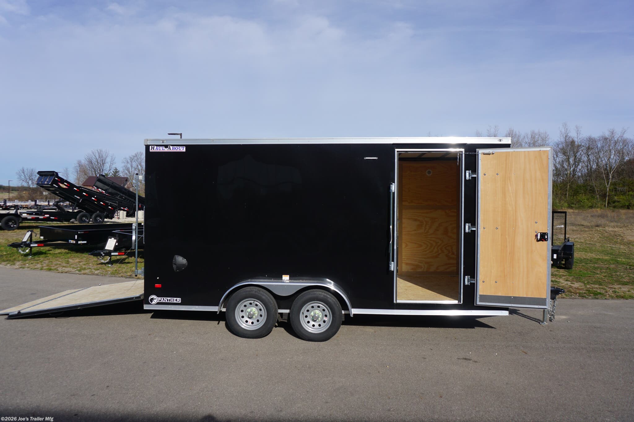 Haul-About 75” x 16’ enclosed trailer, 75” x 16’ trailer, Haul-About aluminum enclosed trailer, dual axle trailer, 2 x 3,500 lb axle trailer, aluminum cargo trailer, bumper pull enclosed trailer, black enclosed trailer, ST205/75R15 trailer tires, 15-inch trailer rims, electric brake trailer, 7,000 lb GVWR trailer, 4,314 lb payload trailer, 2,686 lb curb weight trailer, 75” wide trailer, 16’ long trailer, LED trailer lights, outside LED light with side door switch, 2,000 lb capacity D-rings, recessed floor D-rings, trailer with recessed D-rings, scoop vents trailer, trailer with flush lock, bar lock and flush lock, trailer with flip-up door, UTV trailer, enclosed UTV trailer, trailer for UTV