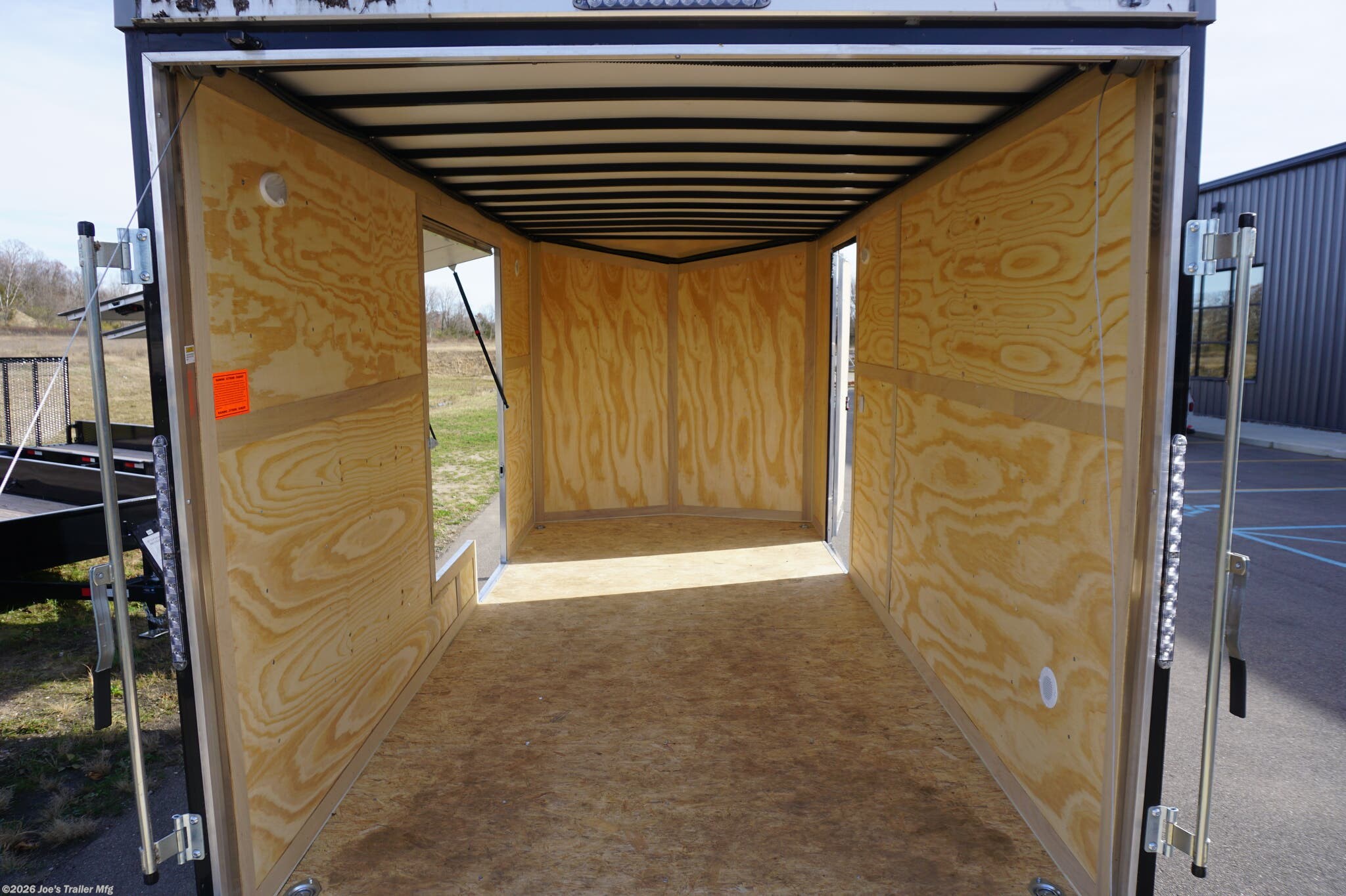 Haul-About 75” x 16’ enclosed trailer, 75” x 16’ trailer, Haul-About aluminum enclosed trailer, dual axle trailer, 2 x 3,500 lb axle trailer, aluminum cargo trailer, bumper pull enclosed trailer, black enclosed trailer, ST205/75R15 trailer tires, 15-inch trailer rims, electric brake trailer, 7,000 lb GVWR trailer, 4,314 lb payload trailer, 2,686 lb curb weight trailer, 75” wide trailer, 16’ long trailer, LED trailer lights, outside LED light with side door switch, 2,000 lb capacity D-rings, recessed floor D-rings, trailer with recessed D-rings, scoop vents trailer, trailer with flush lock, bar lock and flush lock, trailer with flip-up door, UTV trailer, enclosed UTV trailer, trailer for UTV