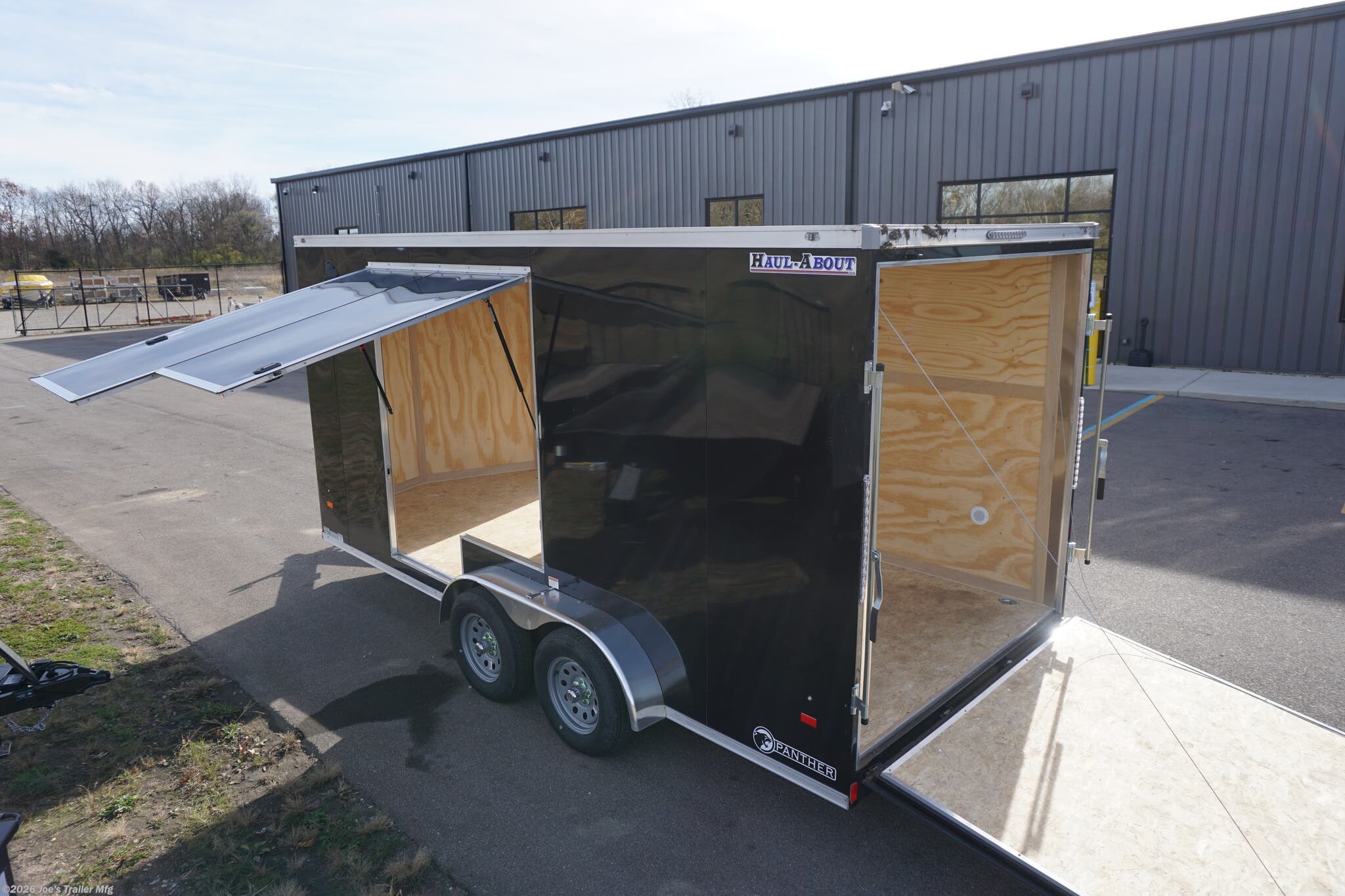 Haul-About 75” x 16’ enclosed trailer, 75” x 16’ trailer, Haul-About aluminum enclosed trailer, dual axle trailer, 2 x 3,500 lb axle trailer, aluminum cargo trailer, bumper pull enclosed trailer, black enclosed trailer, ST205/75R15 trailer tires, 15-inch trailer rims, electric brake trailer, 7,000 lb GVWR trailer, 4,314 lb payload trailer, 2,686 lb curb weight trailer, 75” wide trailer, 16’ long trailer, LED trailer lights, outside LED light with side door switch, 2,000 lb capacity D-rings, recessed floor D-rings, trailer with recessed D-rings, scoop vents trailer, trailer with flush lock, bar lock and flush lock, trailer with flip-up door, UTV trailer, enclosed UTV trailer, trailer for UTV