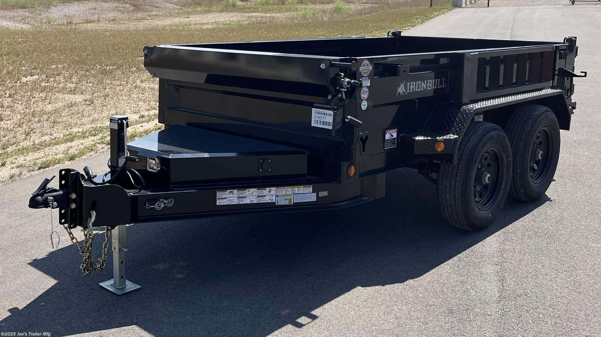 IronBull 5x10 dump trailer, 5x10 dump trailer, 5x10 trailer, IronBull dump trailer, 5x10 dump trailer with 5.2K axles, 2.8 cubic yard dump trailer, dual 6-inch I-Beam frame, 7 gauge steel flooring, heavy-duty steel trailer, 4-inch tubing bed frame, 10 gauge steel sides, 18-inch steel sides, standard retractable tarp kit, 10k drop leg jack, scissor lift dump trailer, adjustable coupler trailer, 2 5/16-inch adjustable coupler, spare tire mount, ramps mounted to side, rear support stand bracket, three-way spreader gate, Powdura powder coat, one cure primer, locking pump box, standard stake pockets, weld-on diamond plate fenders, 5/8-inch D-rings, floor-mounted D-rings, DOT approved LED lighting, lifetime LED lighting, trailer with brakes, equipped brakes, LED voltage indicator, remote control for dump trailer, built-in 5 amp battery charger, heavy-duty dump trailer, small dump trailer, compact dump trailer, versatile dump trailer, farm dump trailer, landscaping dump trailer, construction