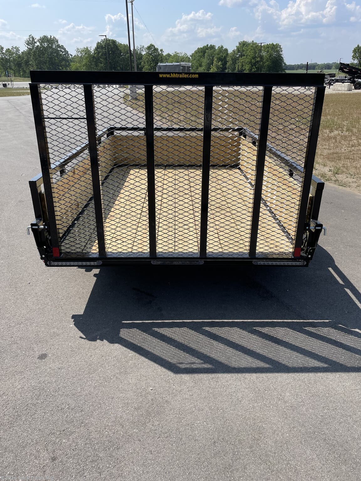 H&H 6'4"X10' 3 Board Utility Trailer, H&H Trailer, Utility Trailer, 3 Board Trailer, 6'4"X10' Trailer, 3"x2" Angle Cross Members, Angle Cross Members, Cross Members, 3 Board Treated Wood Sides, Treated Wood Sides, 2"X 1.5" Tube Sides, 4" Channel Tongue, Channel Tongue, Trailer Tongue, 2" A Frame Coupler, A Frame Coupler, 2K Set Back Jack, Set Back Jack, 2K Jack, 3K Spring Axle, Spring Axle, 3K Axle, ST205/75R15 Load Range C Tires, Load Range C Tires, Trailer Tires, 15" Trailer Tires, LED Lighting, Trailer LED Lighting, LED Lights, Pressure Treated Pine Decking, Treated Pine Decking, Pine Decking, Spring Assisted Ramp Gate 50"X55", Spring Assisted Ramp Gate, Ramp Gate, 20 1/4" Deck Height, Trailer Deck Height, Steel Tread Plate Fenders, Tread Plate Fenders, Steel Fenders, Side Mounted D-Rings, Floor Mounted D-Rings, D-Rings, Spare Tire Mount, Trailer Spare Tire Mount.