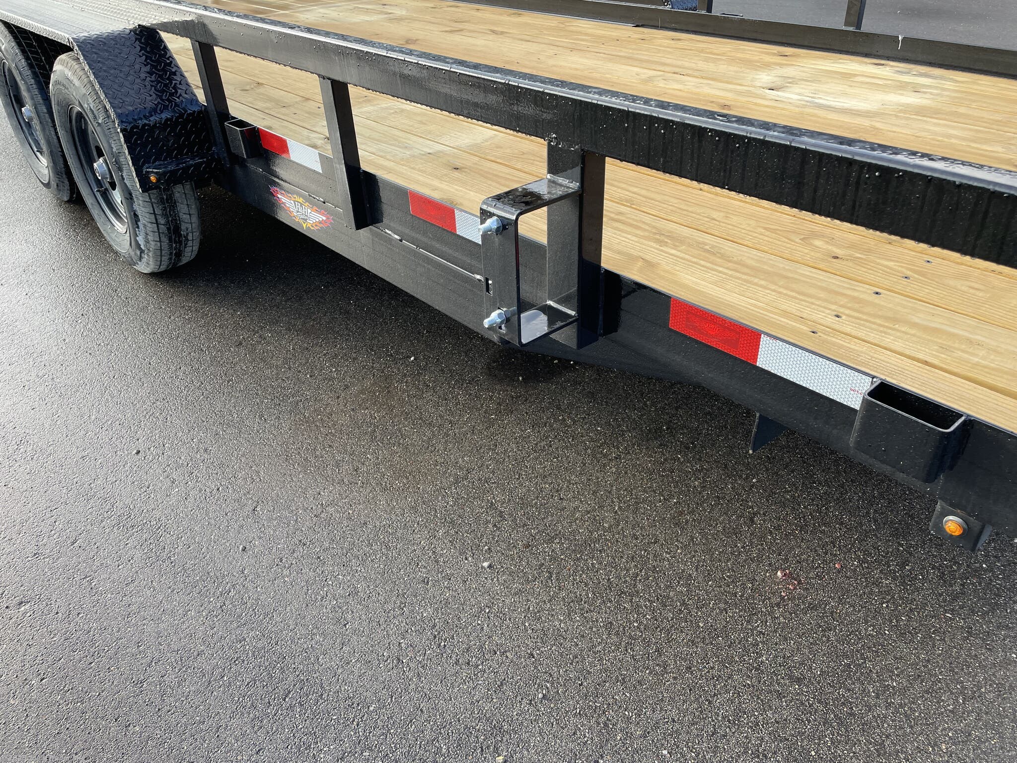 H&H 82" x 18' Heavy Duty Landscape/Utility Trailer, 5" x 3" x 1/4" Steel Angle Frame, 3" x 2" x 3/16" Steel Angle Crossmembers, 5" Steel Channel Tongue, Fully Wrapped, 3" x 2" Steel Tube Top Rail, 2-5/16" A-Frame Posi-Lock Coupler, Dual Safety Chains and Hooks, 7-Way RV-Style Plug, Enclosed Sealed Wiring Harness, 7k Rated Setback Drop Leg Jack, 50" Tall Reinforced Spring Assist Gate, Ladder Style Gate, Steel Formed Tread Plate Fenders, Tandem Spring Brake Suspension, 9900 lb GVWR, Easy Lube Hubs, ST225/75R15 'D' Tires, 15" Black Steel Wheels, Industrial Grade Polymer Finish, 2 x 8 Pressure Treated Pine Decking, Welded Front Board Retainer, Rear End Board Cap, Stake Pockets, Spare Tire Mount, Full LED DOT Compliant Lighting, Heavy Duty Landscape Trailer, Utility Trailer with Steel Frame, Steel Angle Crossmembers Trailer, Heavy Duty Trailer with Spring Assist Gate, Tandem Brake Suspension Trailer, Pressure Treated Pine Deck Utility Trailer, Steel Tube Top Rail Trailer, DOT Compliant Trai