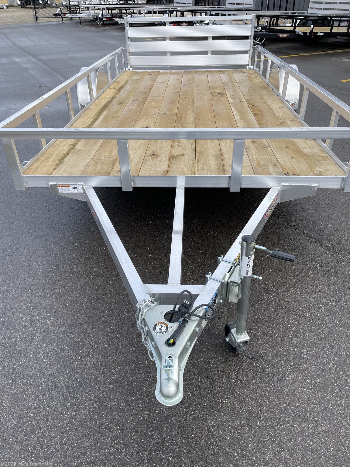 Utility Trailer H & H 7 X 14 Aluminum Rail Side, 3 X 2 Angle Aluminum Extrusion Frame, Aluminum Extrusion Tube Upright Sides, 2 x 2 Tube Top Rail, Aluminum Triple Tube Tongue, Treated Wood Deck, 15" Aluminum Wheels, 15" Radial Tires, A-Frame Posi-lock Coupler, Dual Safety Chains & Hooks, Swivel Jack with Caster Wheel, LED Lighting, Sealed Wiring Harness, Aluminum Stake Pockets, 54" Bi-Fold Gate, Brakes: None, Load Angle & Ramp Length, Load Angle: 17°, Ramp Length: 58", Ramp Pivot Point Measurements, Aluminum Trailer Accessories, Heavy Duty Aluminum Trailer, Aluminum Extrusion Components, Trailer Parts and Accessories, Custom Aluminum Trailer Features, Durable Aluminum Trailer, LED Trailer Lighting, Swivel Jack Trailer Equipment, Safety Chains and Hooks, Aluminum Stake Pocket Design, Treated Wood Decking for Trailers, 15" Radial Trailer Tires, A-Frame Coupler Trailer, Bi-Fold Gate Trailer, High-Quality Aluminum Wheels, Ramp Length Specifications, Trailer Load Angle, Aluminum Extrusion T