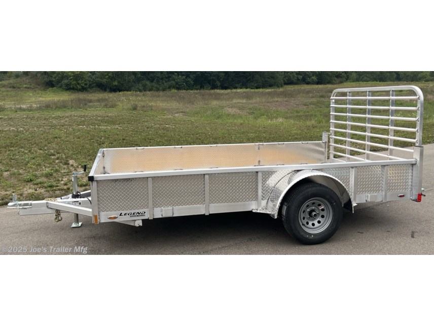Legend Open Deluxe 7X12 Utility Trailer, 4" Tube Main Frame Utility Trailer, 24" OC Crossmembers Trailer, 15" Side Rails With Skirting, 2" Coupler Trailer, ST205/75R14 Steel Tires Trailer, ATP Fenders Utility Trailer, Treated Wood Decking Trailer, (4) Stake Pockets Utility Trailer, No Brakes Utility Trailer, Load Angle 19° Trailer, Ramp Length 48" Trailer, Ramp Pivot Point Trailer, Heavy Duty Utility Trailer, Durable Utility Trailer, Steel Tires Utility Trailer, Tubular Frame Trailer, Crossmembers Spacing 24" Trailer, Side Rails With Skirting Utility Trailer, Coupler 2" Trailer, Aluminum Fenders Utility Trailer, Wood Decking Treated, Stake Pockets 4 Trailer, Trailer Without Brakes, Load Angle 19 Degrees, Ramp Length 48 Inches, Utility Trailer Specs, Trailer Features, Utility Trailer Specifications, Legend Trailer Features, Deluxe Utility Trailer, Open Utility Trailer