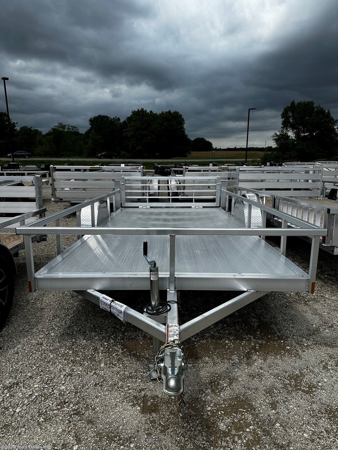 Legend 7X14' Open Deluxe Utility Trailer, 17" Deck Height Utility Trailer, 48" Bi Fold Ramp Gate Trailer, 3.5k EZ-Lube Spring Axle Trailer, ST205/75R14 Silver Mod Steel Tires, 3" Tube Cross Members Trailer, 24" On Center Cross Member Spacing, 4" Tube Frame Utility Trailer, Aluminum Flooring Trailer, LED Lighting Utility Trailer, 2" Straight Coupler Trailer, 2k Top-Wind Jack Utility Trailer, ATP Fenders Trailer, Stake Pockets Utility Trailer, Heavy Duty Utility Trailer, Open Utility Trailer 7X14, Deluxe Utility Trailer with Ramp Gate, Spring Axle Utility Trailer, Steel Tires Utility Trailer, Tube Cross Members Utility Trailer, Cross Member Spacing Utility Trailer, Tube Frame Trailer, Flooring Aluminum Trailer, LED Lights Utility Trailer, Coupler Trailer Parts, Top-Wind Jack Utility Trailer, Fenders ATP Utility Trailer, Stake Pockets Utility Trailer Features