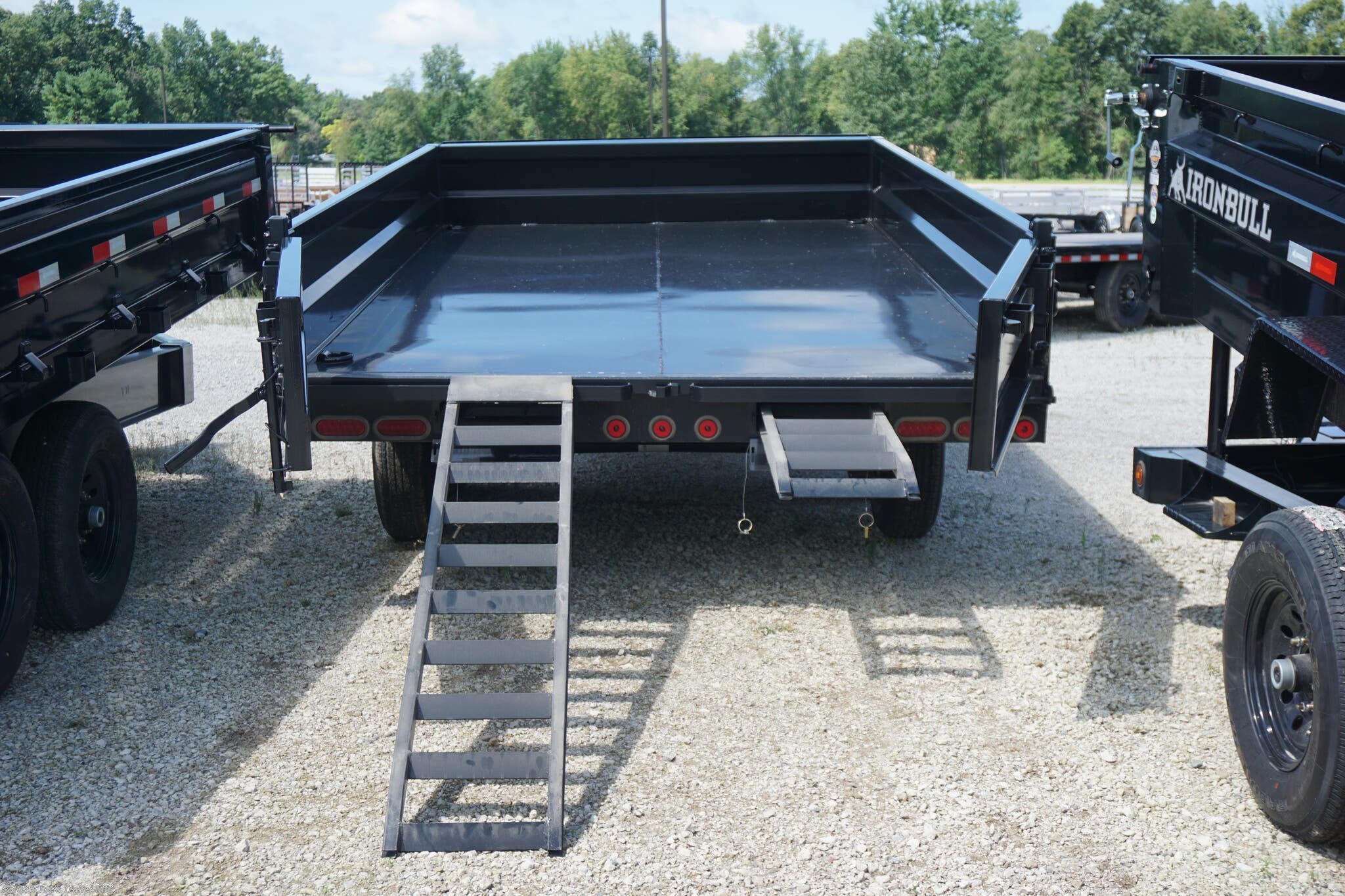 IRONBULL DDP9614, 14,999# GVWR, 4762# curb weight, 10,237# payload, 10 GA 18" fold down sides, 18" 3-way rear gate, 10 GA one piece floor, 10K spring loaded drop jack, 10" I-beam frame, roll tarp system, D-ring tie downs, scissor hoist, slide in ramps, three-way spreader gate, 3 year structural warranty, 2 year component warranty, 16" radial tires, heavy-duty trailer, dump trailer, industrial trailer, construction trailer, trailer with drop jack, high-capacity trailer, reinforced trailer, durable trailer, fold down sides trailer, spreader gate trailer, radial tire trailer, heavy load trailer, trailer with scissor hoist, trailer with slide-in ramps, one-piece floor trailer, roll tarp trailer, 3-way rear gate trailer, tie-down D-rings, I-beam frame trailer, robust trailer, long-lasting trailer, trailer with high payload, trailer with high GVWR