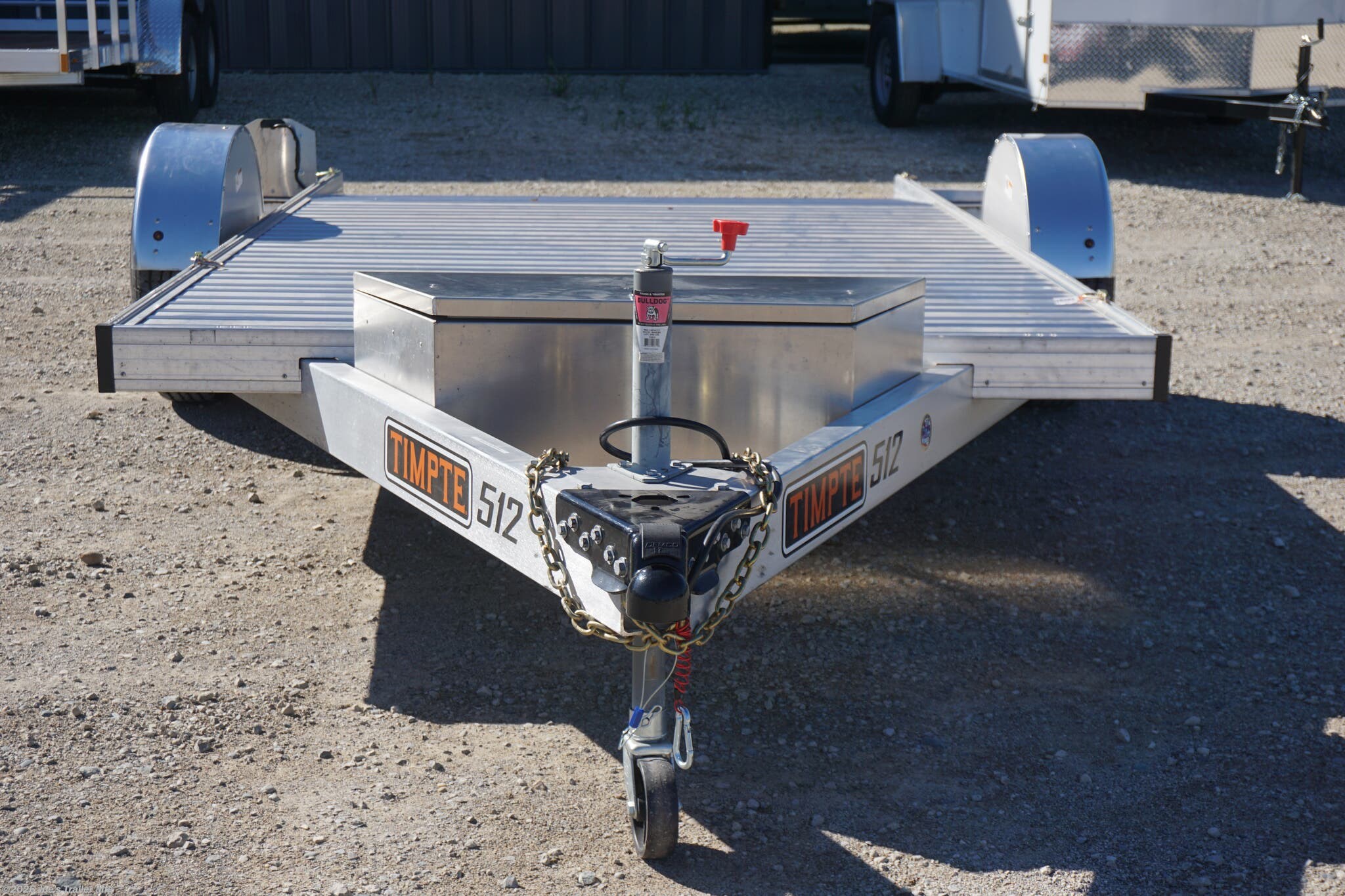 2024 Timpte 0512TSEZ Utility Trailer, Timpte trailers, utility trailer specifications, 5,000 lbs GVWR trailer, heavy-duty trailer, EZ Loader Drop Deck System, wireless remote trailer, vehicle hauling trailer, equipment transport trailer, material transport trailer, durable utility trailer, trailer with torsion axle, trailer with electric self-adjusting brakes, radial tire trailer, ST225/75R15 radial tires, full LED lighting trailer, Wilmington NC trailer, new utility trailer for sale, 144-inch trailer length, 75-inch trailer width, 2,000 lbs top wind jack, 2 5/16" coupler trailer, bumper pull hitch type, trailer with 4 D rings, high-quality material trailer, weather-resistant trailer, trailer with precision engineering, Wilmington trailer dealer, 2024 trailer models, GVWR trailer, one axle trailer, utility trailer with wireless remote, reliable hauling trailer, best trailer for heavy loads, Timpte 2024 trailer lineup, self-adjusting brakes trailer, trailer with full LED package, Wilmin