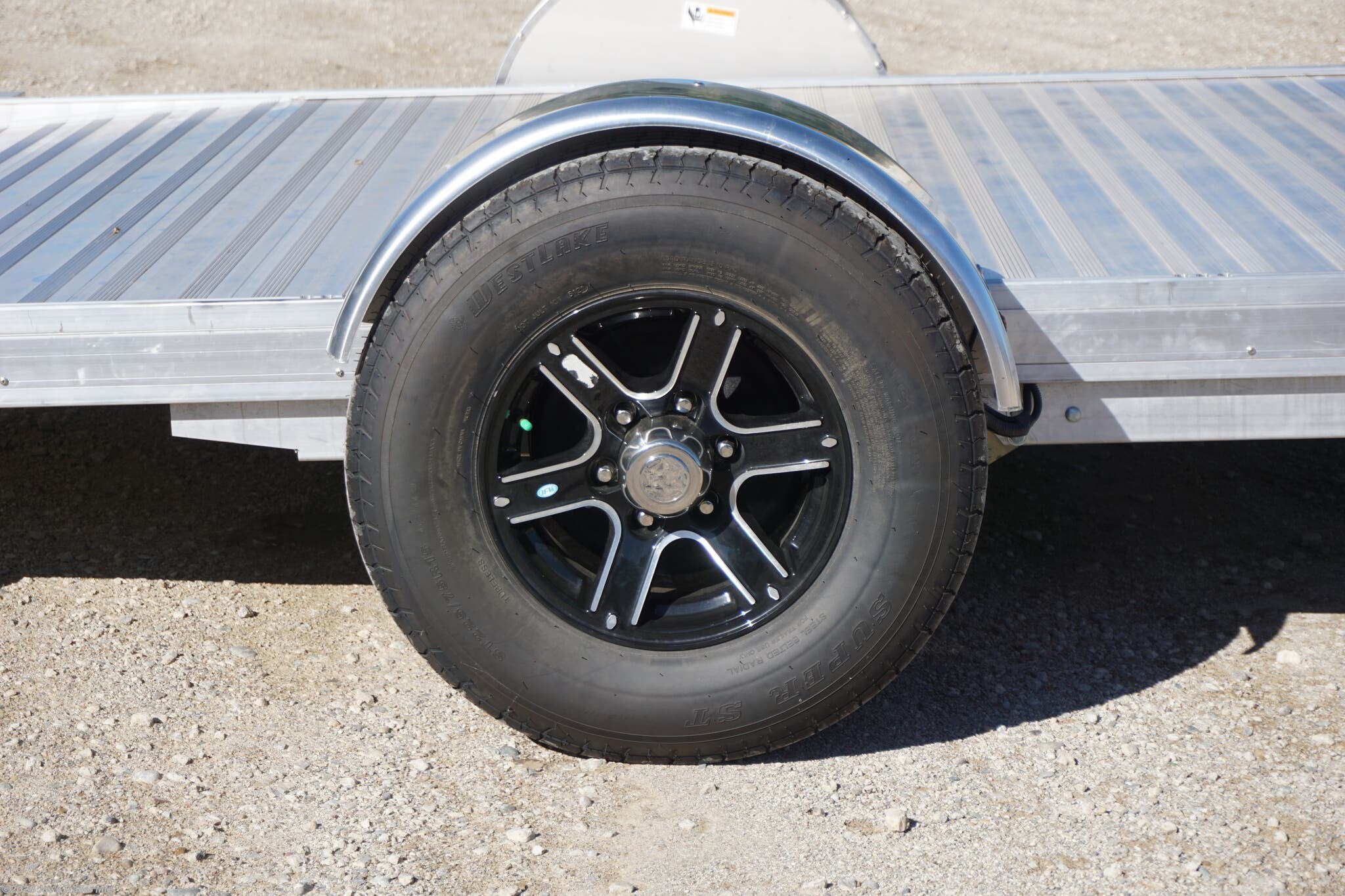 2024 Timpte 0512TSEZ Utility Trailer, Timpte trailers, utility trailer specifications, 5,000 lbs GVWR trailer, heavy-duty trailer, EZ Loader Drop Deck System, wireless remote trailer, vehicle hauling trailer, equipment transport trailer, material transport trailer, durable utility trailer, trailer with torsion axle, trailer with electric self-adjusting brakes, radial tire trailer, ST225/75R15 radial tires, full LED lighting trailer, Wilmington NC trailer, new utility trailer for sale, 144-inch trailer length, 75-inch trailer width, 2,000 lbs top wind jack, 2 5/16" coupler trailer, bumper pull hitch type, trailer with 4 D rings, high-quality material trailer, weather-resistant trailer, trailer with precision engineering, Wilmington trailer dealer, 2024 trailer models, GVWR trailer, one axle trailer, utility trailer with wireless remote, reliable hauling trailer, best trailer for heavy loads, Timpte 2024 trailer lineup, self-adjusting brakes trailer, trailer with full LED package, Wilmin