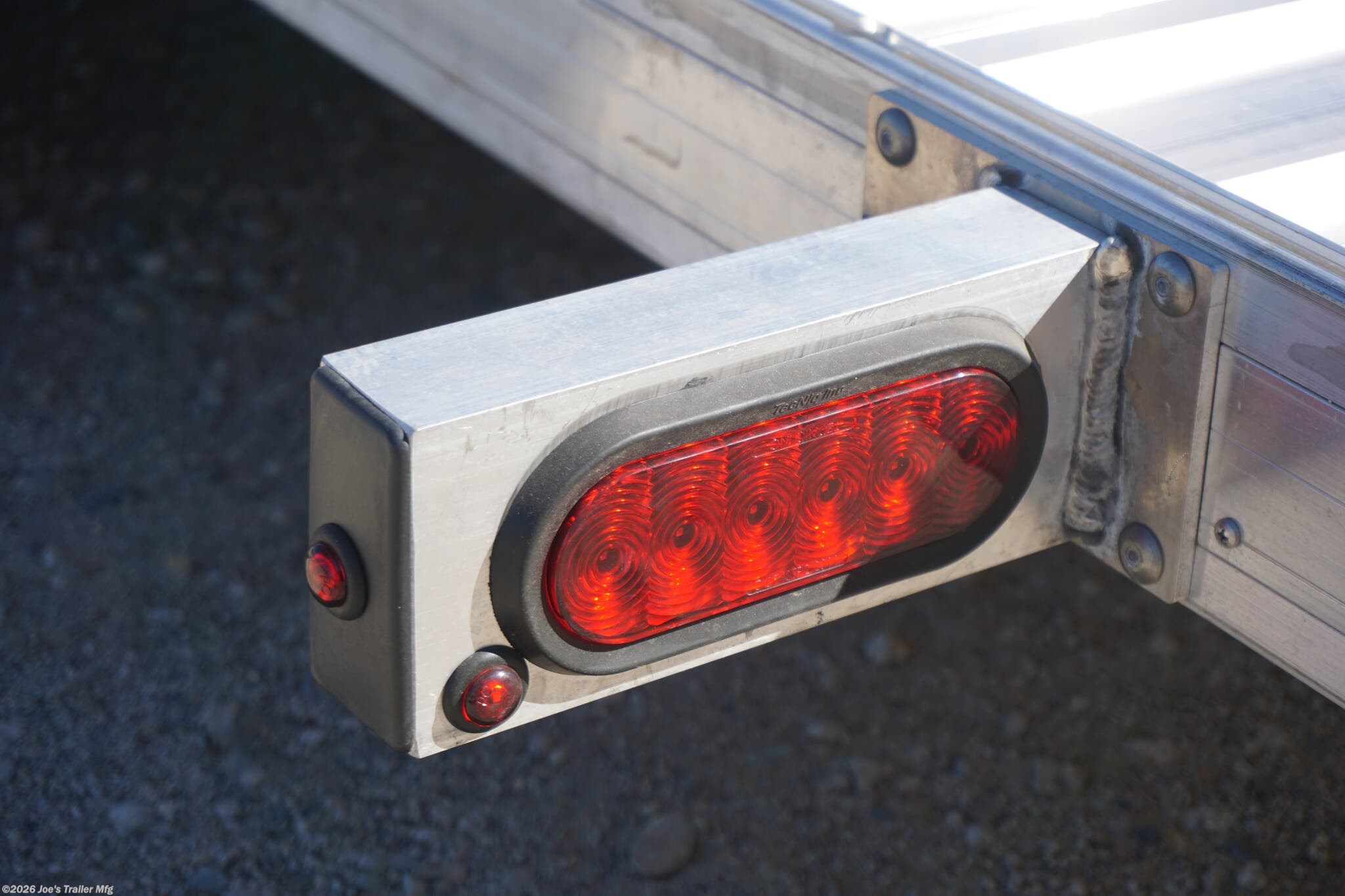 2024 Timpte 0512TSEZ Utility Trailer, Timpte trailers, utility trailer specifications, 5,000 lbs GVWR trailer, heavy-duty trailer, EZ Loader Drop Deck System, wireless remote trailer, vehicle hauling trailer, equipment transport trailer, material transport trailer, durable utility trailer, trailer with torsion axle, trailer with electric self-adjusting brakes, radial tire trailer, ST225/75R15 radial tires, full LED lighting trailer, Wilmington NC trailer, new utility trailer for sale, 144-inch trailer length, 75-inch trailer width, 2,000 lbs top wind jack, 2 5/16" coupler trailer, bumper pull hitch type, trailer with 4 D rings, high-quality material trailer, weather-resistant trailer, trailer with precision engineering, Wilmington trailer dealer, 2024 trailer models, GVWR trailer, one axle trailer, utility trailer with wireless remote, reliable hauling trailer, best trailer for heavy loads, Timpte 2024 trailer lineup, self-adjusting brakes trailer, trailer with full LED package, Wilmin