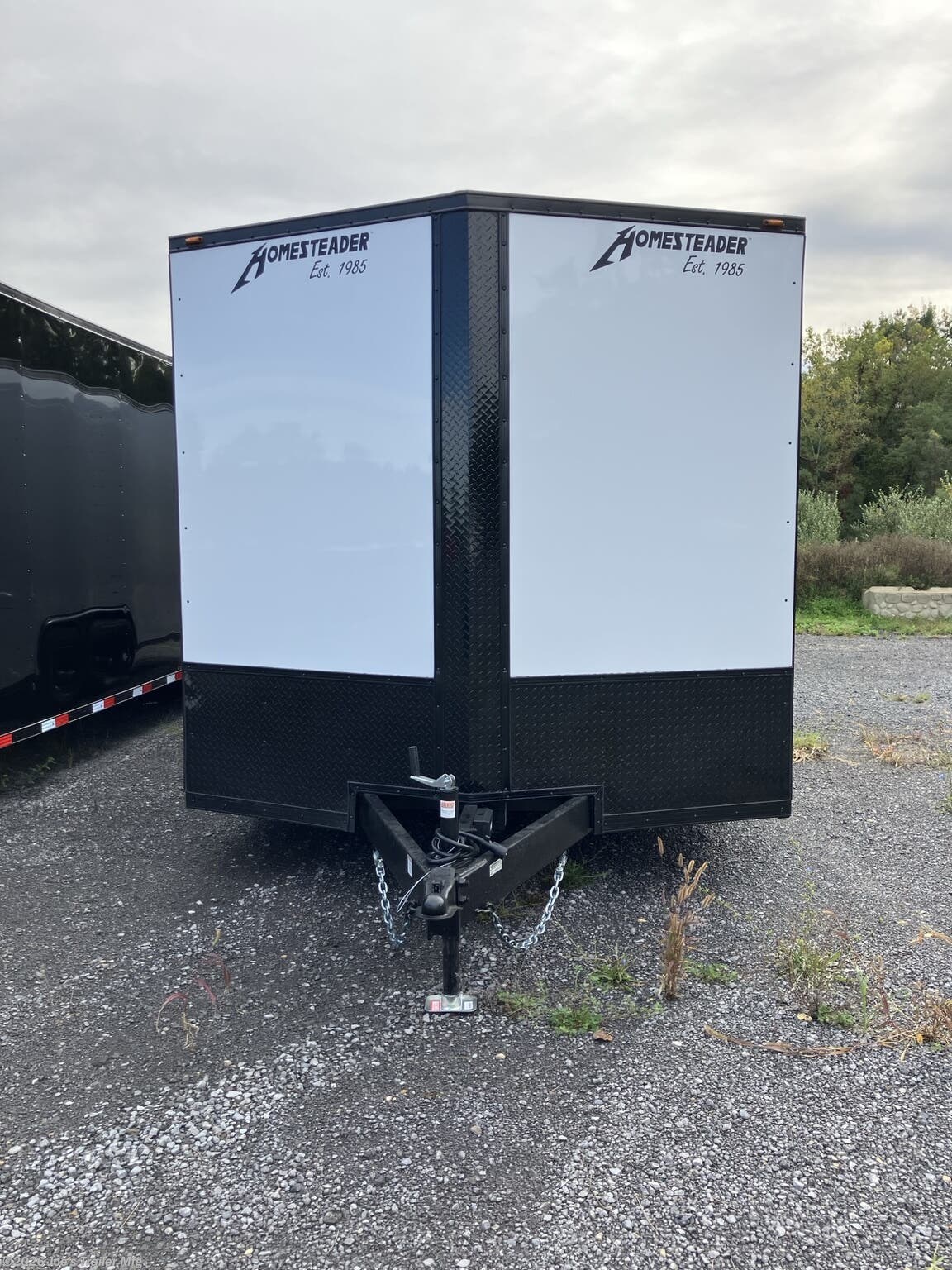 2027 Homesteader 8x24 9950 GVWR 84" IH Blacked Out Exterior
