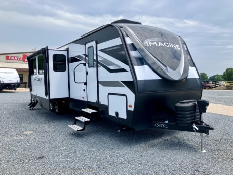 &lt;p&gt;&lt;span style=&quot;font-family: verdana, geneva, sans-serif;&quot;&gt;&lt;strong&gt;2024 Grand Design Imagine 3210BH Travel Trailer&lt;/strong&gt;&lt;/span&gt;&lt;/p&gt;
&lt;p&gt;&lt;span style=&quot;font-family: verdana, geneva, sans-serif;&quot;&gt;&lt;em&gt;Quad Bunks, Outdoor Kitchen, Theater Seating...&lt;/em&gt;&lt;/span&gt;&lt;/p&gt;
&lt;ul&gt;
&lt;li&gt;&lt;span style=&quot;font-family: verdana, geneva, sans-serif;&quot;&gt;Peace of Mind Pkg&lt;/span&gt;&lt;/li&gt;
&lt;li&gt;&lt;span style=&quot;font-family: verdana, geneva, sans-serif;&quot;&gt;Ultimate Power Pkg&lt;/span&gt;&lt;/li&gt;
&lt;li&gt;&lt;span style=&quot;font-family: verdana, geneva, sans-serif;&quot;&gt;Four Seasons Protection Pkg&lt;/span&gt;&lt;/li&gt;
&lt;li&gt;&lt;span style=&quot;font-family: verdana, geneva, sans-serif;&quot;&gt;Solar Pkg&lt;/span&gt;&lt;/li&gt;
&lt;li&gt;&lt;span style=&quot;font-family: verdana, geneva, sans-serif;&quot;&gt;Goodyear Tires&lt;/span&gt;&lt;/li&gt;
&lt;li&gt;&lt;span style=&quot;font-family: verdana, geneva, sans-serif;&quot;&gt;SafeRide RV Roadside Assistance&lt;/span&gt;&lt;/li&gt;
&lt;li&gt;&lt;span style=&quot;font-family: verdana, geneva, sans-serif;&quot;&gt;ABS Axle Assembly&lt;/span&gt;&lt;/li&gt;
&lt;li&gt;&lt;span style=&quot;font-family: verdana, geneva, sans-serif;&quot;&gt;15,000 btu&amp;nbsp;Ducted Air Conditioner&lt;/span&gt;&lt;/li&gt;
&lt;li&gt;&lt;span style=&quot;font-family: verdana, geneva, sans-serif;&quot;&gt;13,500 btu&amp;nbsp;Air Conditioner - Bedroom&lt;/span&gt;&lt;/li&gt;
&lt;li&gt;&lt;span style=&quot;font-family: verdana, geneva, sans-serif;&quot;&gt;Booth Dinette&lt;/span&gt;&lt;/li&gt;
&lt;li&gt;&lt;span style=&quot;font-family: verdana, geneva, sans-serif;&quot;&gt;Theater Seating&lt;/span&gt;&lt;/li&gt;
&lt;/ul&gt;
&lt;p&gt;&lt;span style=&quot;font-style: italic; font-weight: bold;&quot;&gt;Our Sale Price Includes: &amp;nbsp;Pre-Delivery Inspection, RV/Marine Battery, Propane Bottles Filled, Walk&amp;nbsp;&lt;/span&gt;&lt;em&gt;&lt;strong&gt;Thru&lt;/strong&gt;&lt;/em&gt;&lt;span style=&quot;font-style: italic; font-weight: bold;&quot;&gt;&amp;nbsp;Orientation &amp;amp; Factory Freight Charges...&lt;/span&gt;&lt;/p&gt;