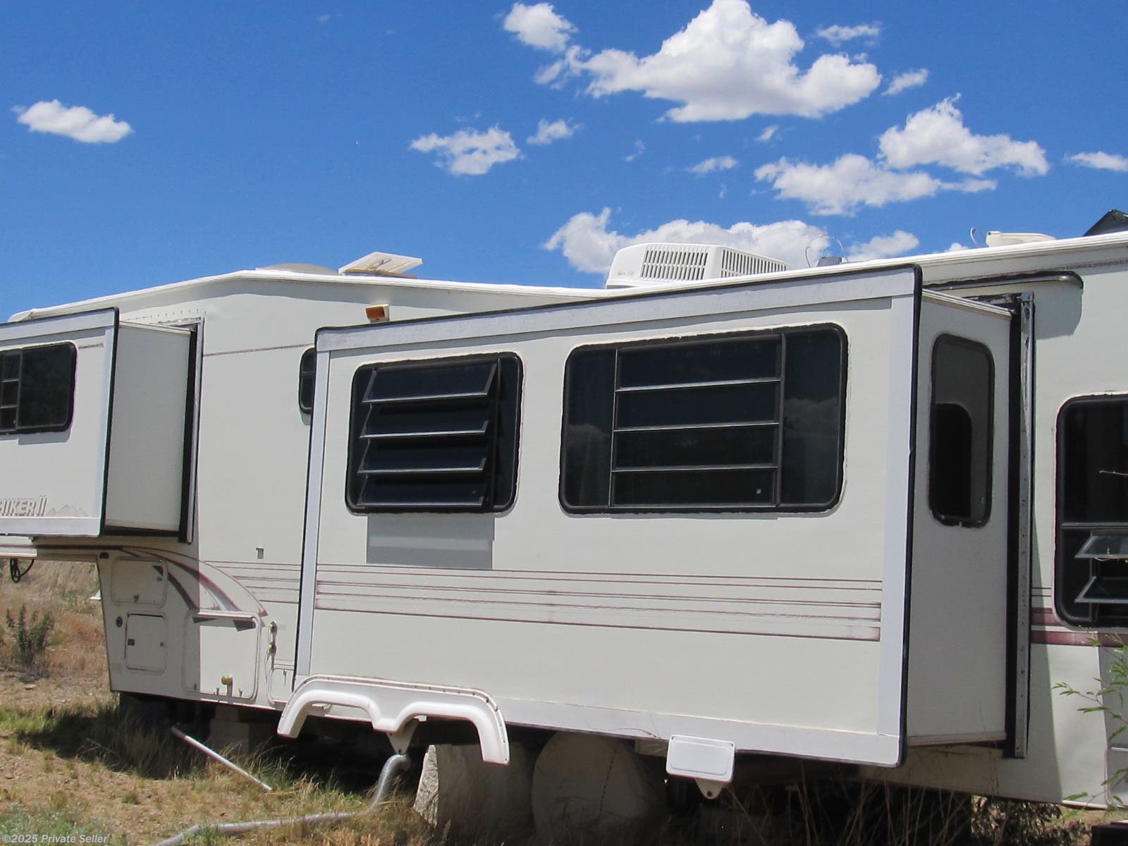 1996 NuWa Hitchhiker II Bedroom and living room slide outs. RV for