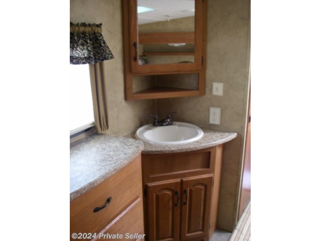 sink, vanity with storage underneath, new faucets