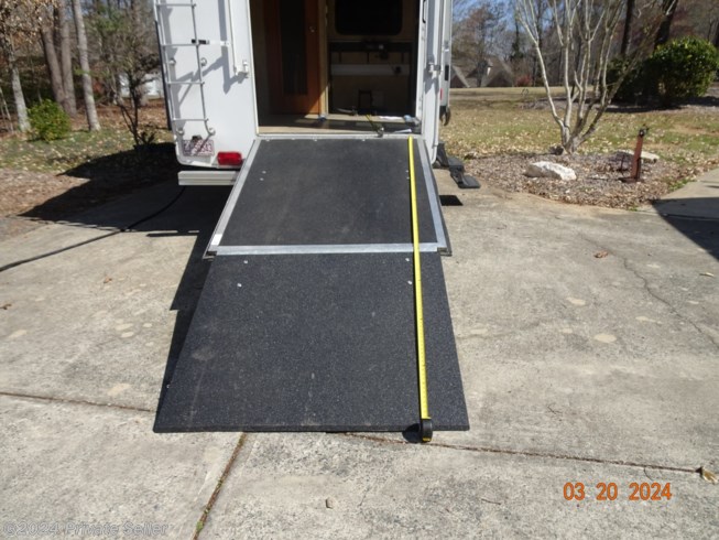 Ramp is 11 feet, 4 inches in length. The mid point support is adjustable in height.