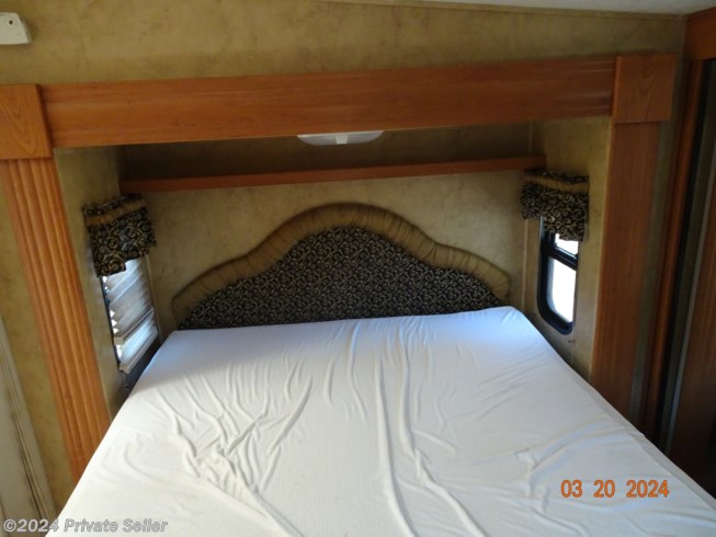 Bedroom with slide out, queen size bed with storage underneath