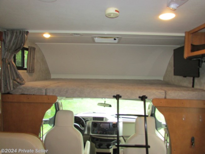 Overhead Bunk with TV, DVD player, ladder, etc. 