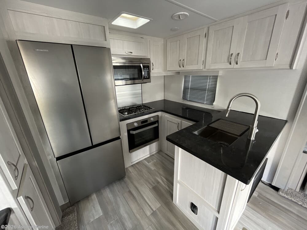 2024 Prime Time LaCrosse 3411RK - Used Travel Trailer For Sale by Ashley Marine & RV in Panama City, Florida features Toilet, Slam Latch Baggage Doors, Dinette, Detachable Power Cord, Enclosed Underbelly