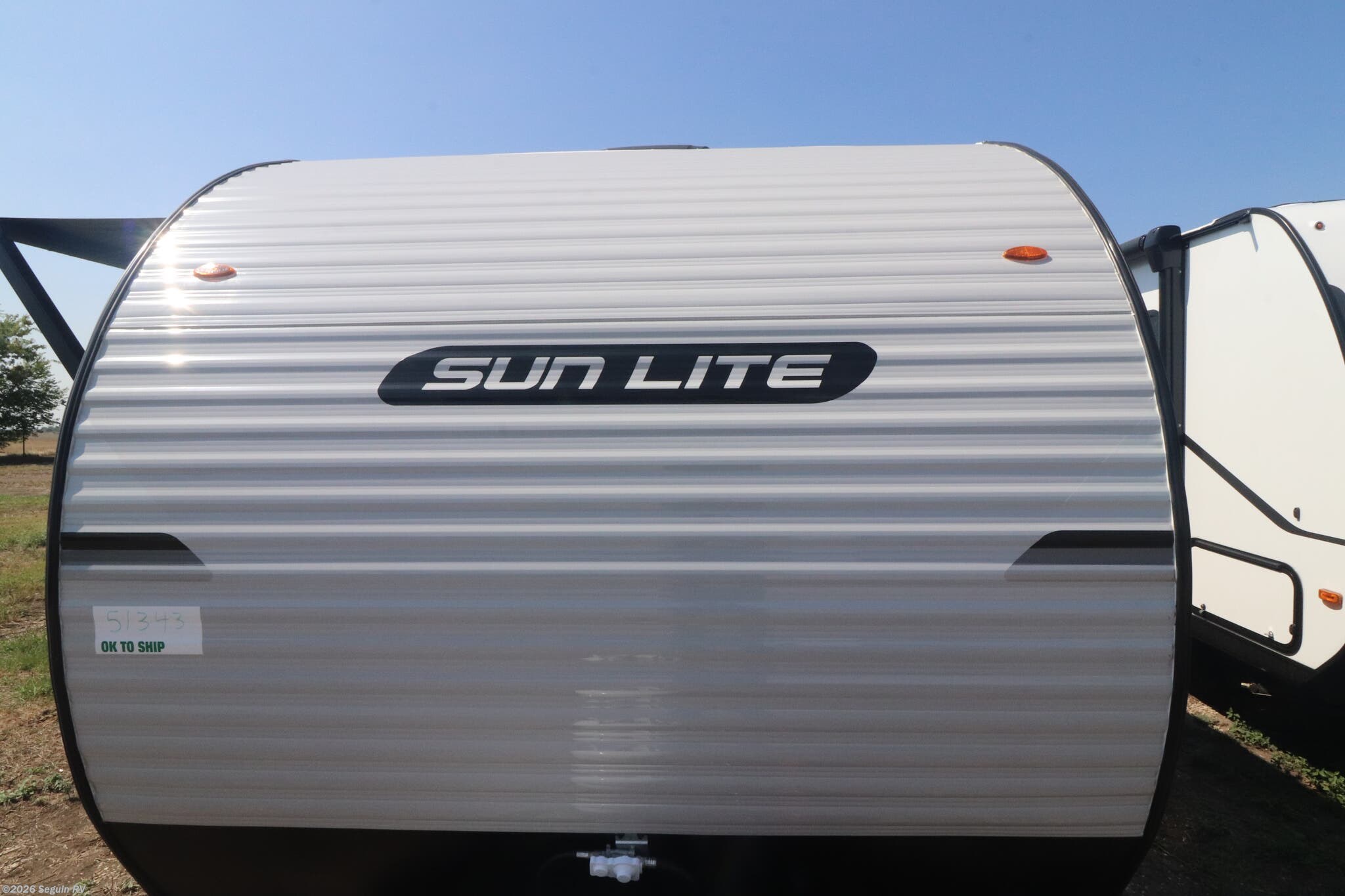 2026 Sunset Park RV Sun Lite LTD 19RBLTD - New Travel Trailer For Sale by Seguin RV in Seguin, Texas features Spare Tire Kit, Propane, Self Contained, Queen Bed, Solar Panels