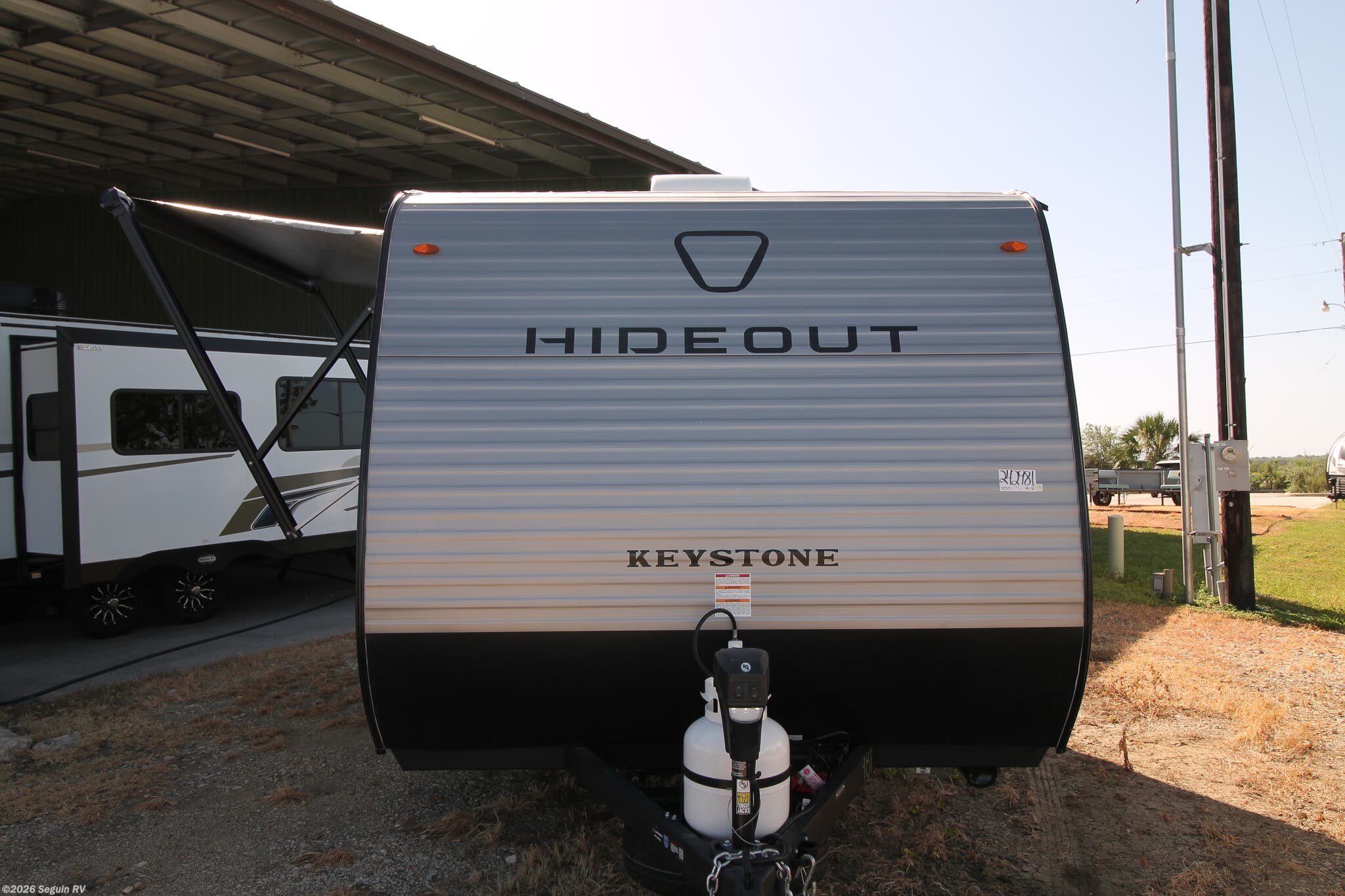 2027 Keystone Hideout Mini 123BB - New Travel Trailer For Sale by Seguin RV in Seguin, Texas features Microwave, Stabilizer Jacks, Skylight, Inverter, Smoke Detector