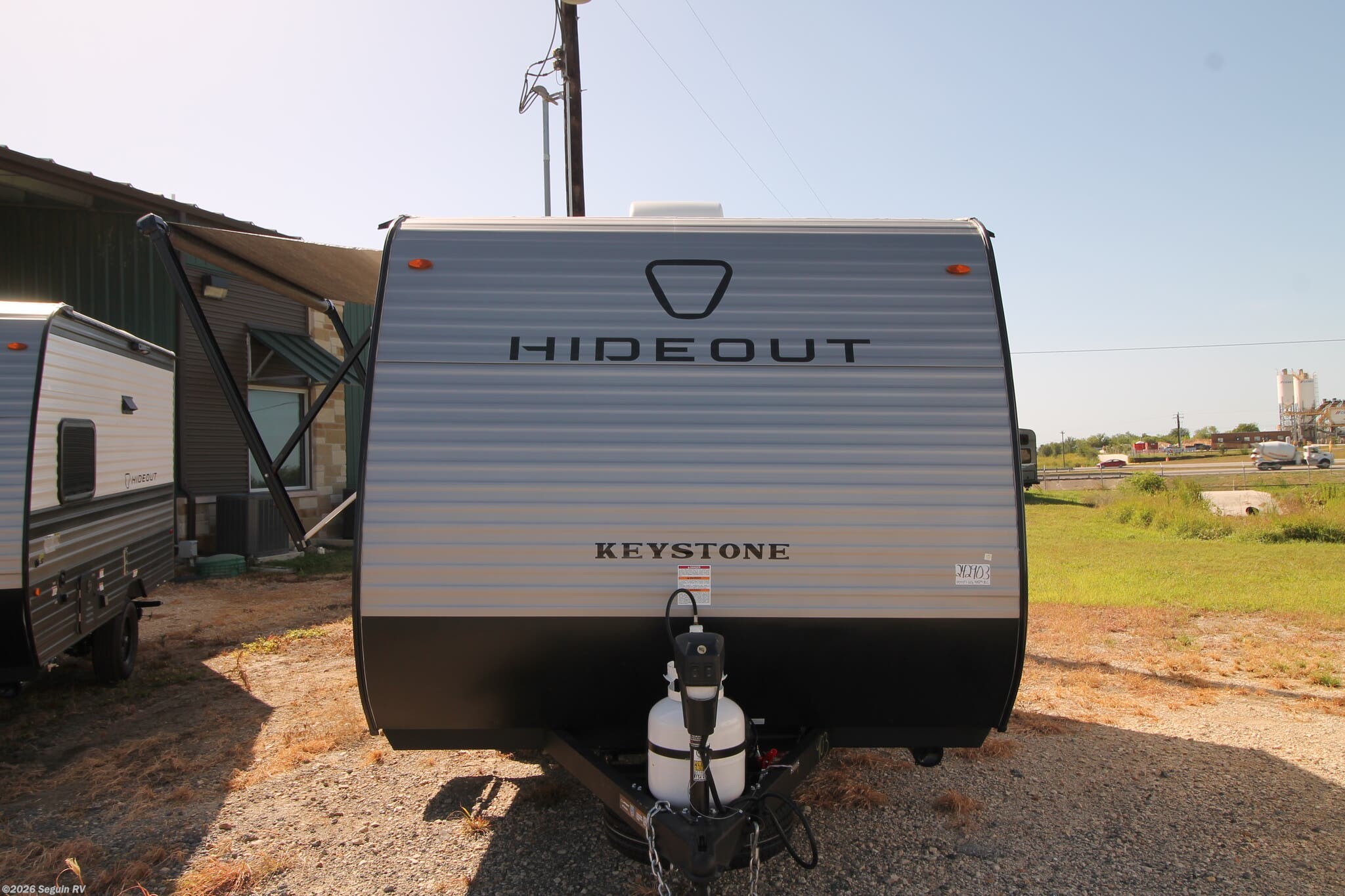 2026 Keystone Hideout Mini 123BB - New Travel Trailer For Sale by Seguin RV in Seguin, Texas features Furnace, Refrigerator, Power Awning, Microwave, Ladder