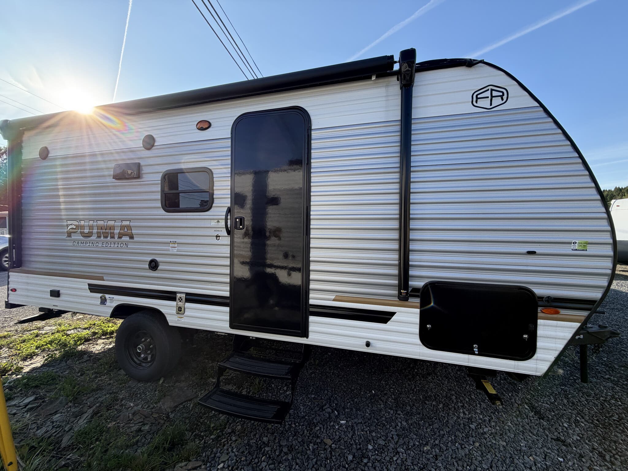 2026 Palomino Puma Camping Edition 16DSCE - New Travel Trailer For Sale by Hometown RV LLC in Brockway, Pennsylvania features Smoke Detector, Microwave, Spare Tire Kit, Queen Bed, Refrigerator