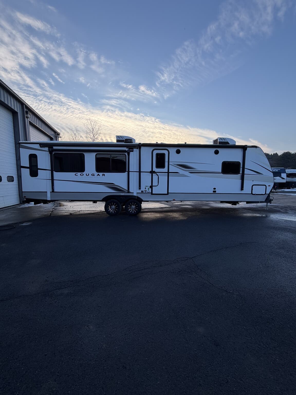 2024 Keystone Cougar 33RLI - Used Travel Trailer For Sale by Hometown RV LLC in Brockway, Pennsylvania features Converter, Power Stabilizer Jacks, Power Awning, Fire Extinguisher, Awning