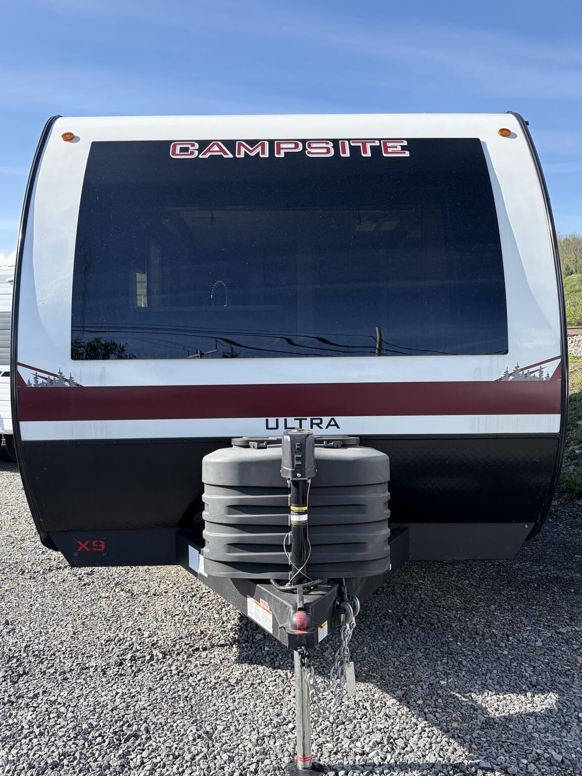 2025 Forest River Campsite Ultra 19KB - Used Travel Trailer For Sale by Hometown RV LLC in Brockway, Pennsylvania features TV, Microwave, Converter, Sofa Bed, Pleated Shades