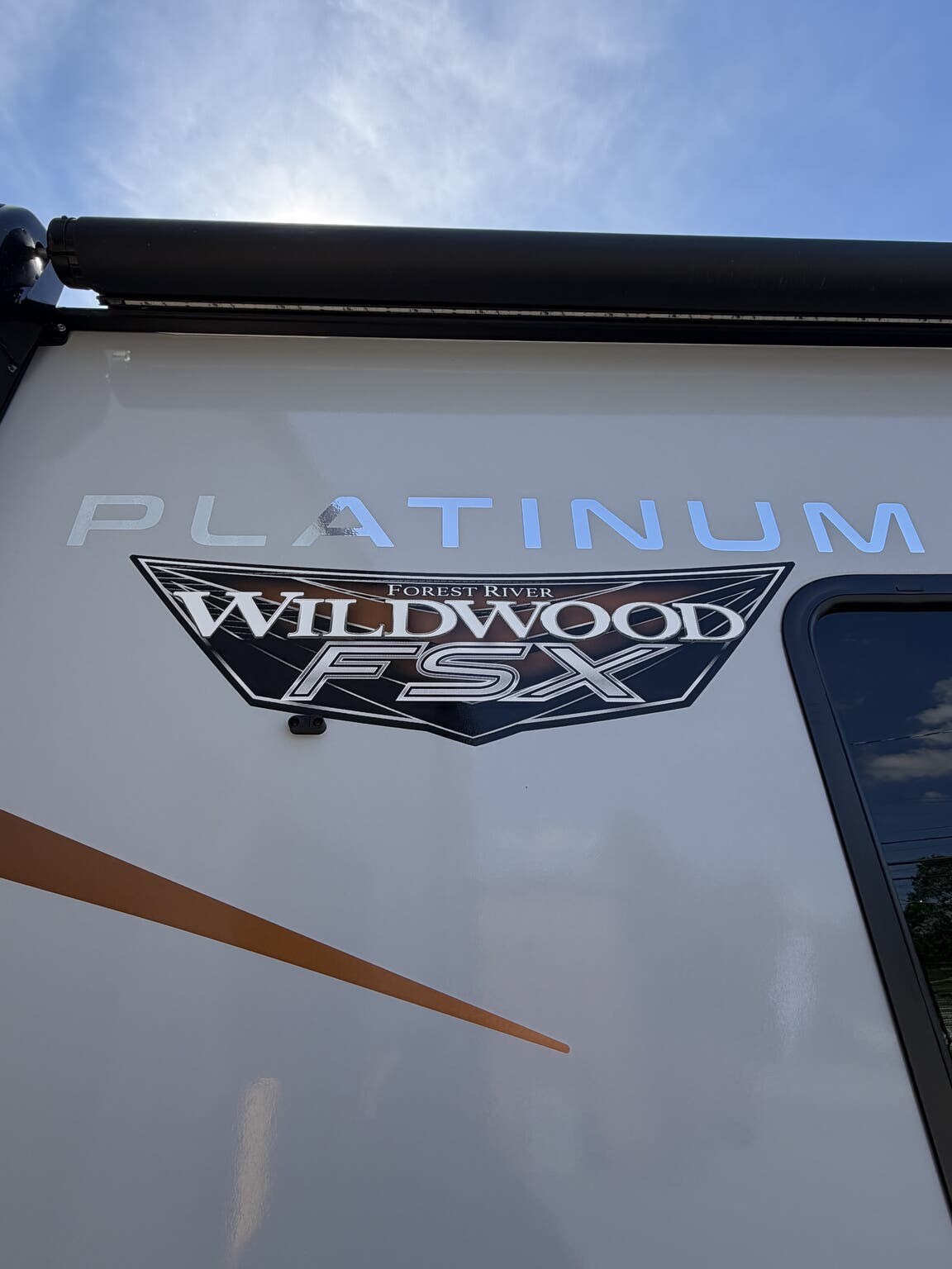 2023 Forest River Wildwood FSX 167RBK Platinum - Used Travel Trailer For Sale by Hometown RV LLC in Brockway, Pennsylvania features Power Awning, Fire Extinguisher, Tinted Windows, Smoke Detector, Fiberglass Sidewalls