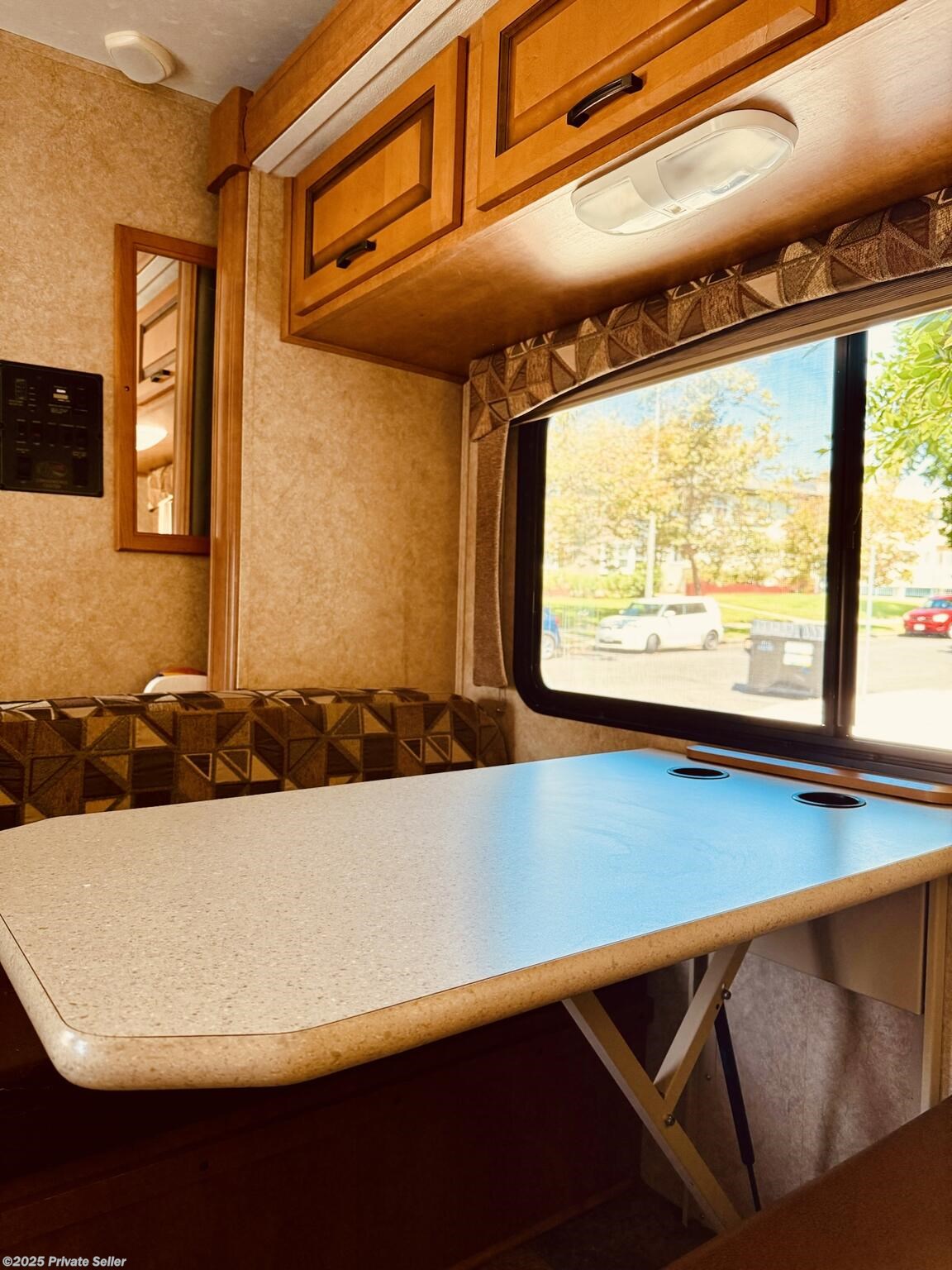 Dinette booth with ample pantry that converts to full bed including slideout.