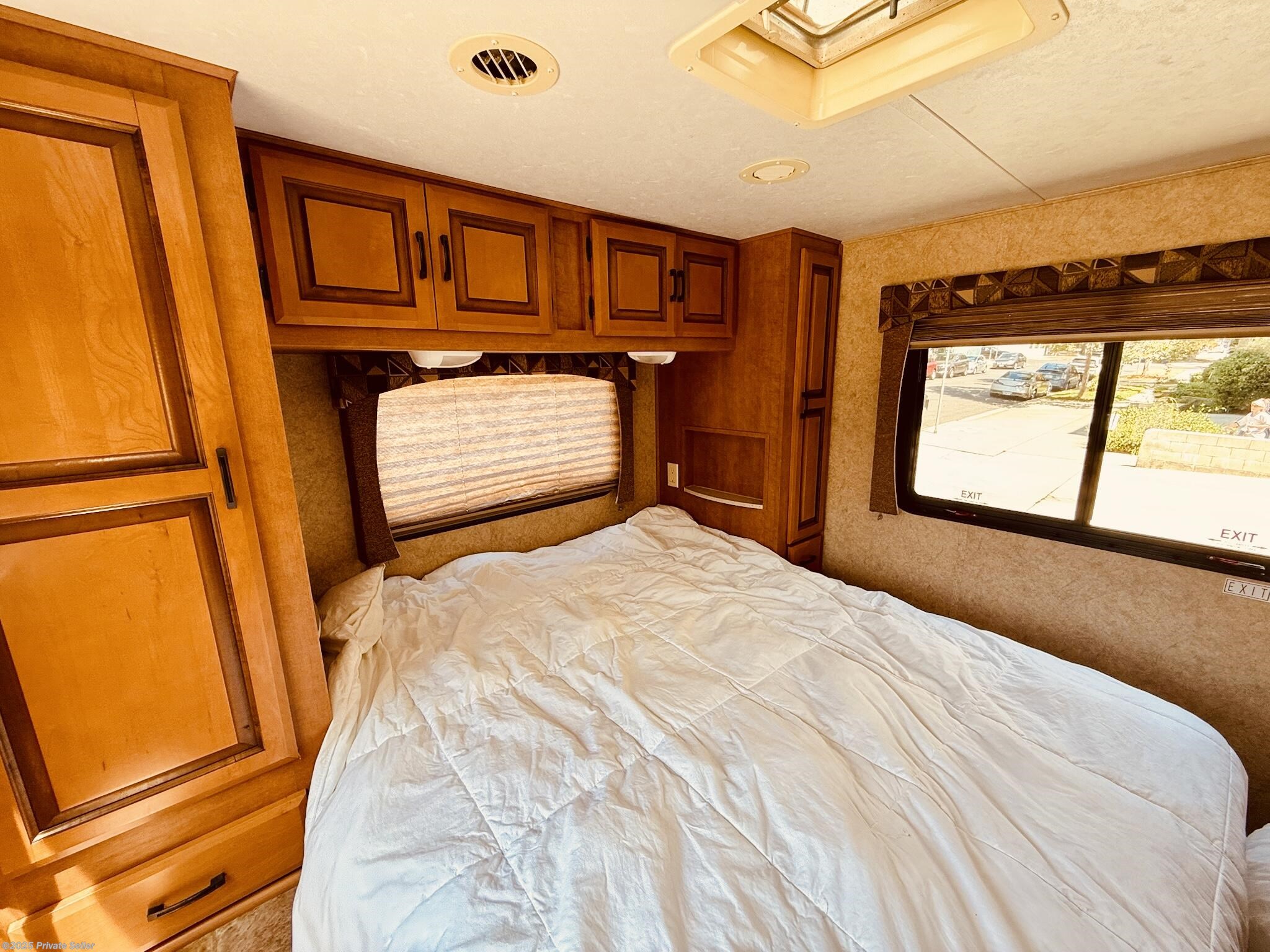 Rear bedroom with queen pillowtop mattress, TV and ample closet space. 