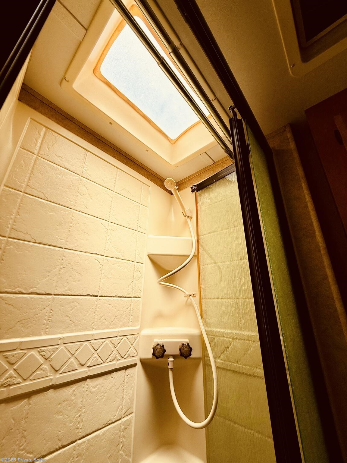 Shower stall has skylight!