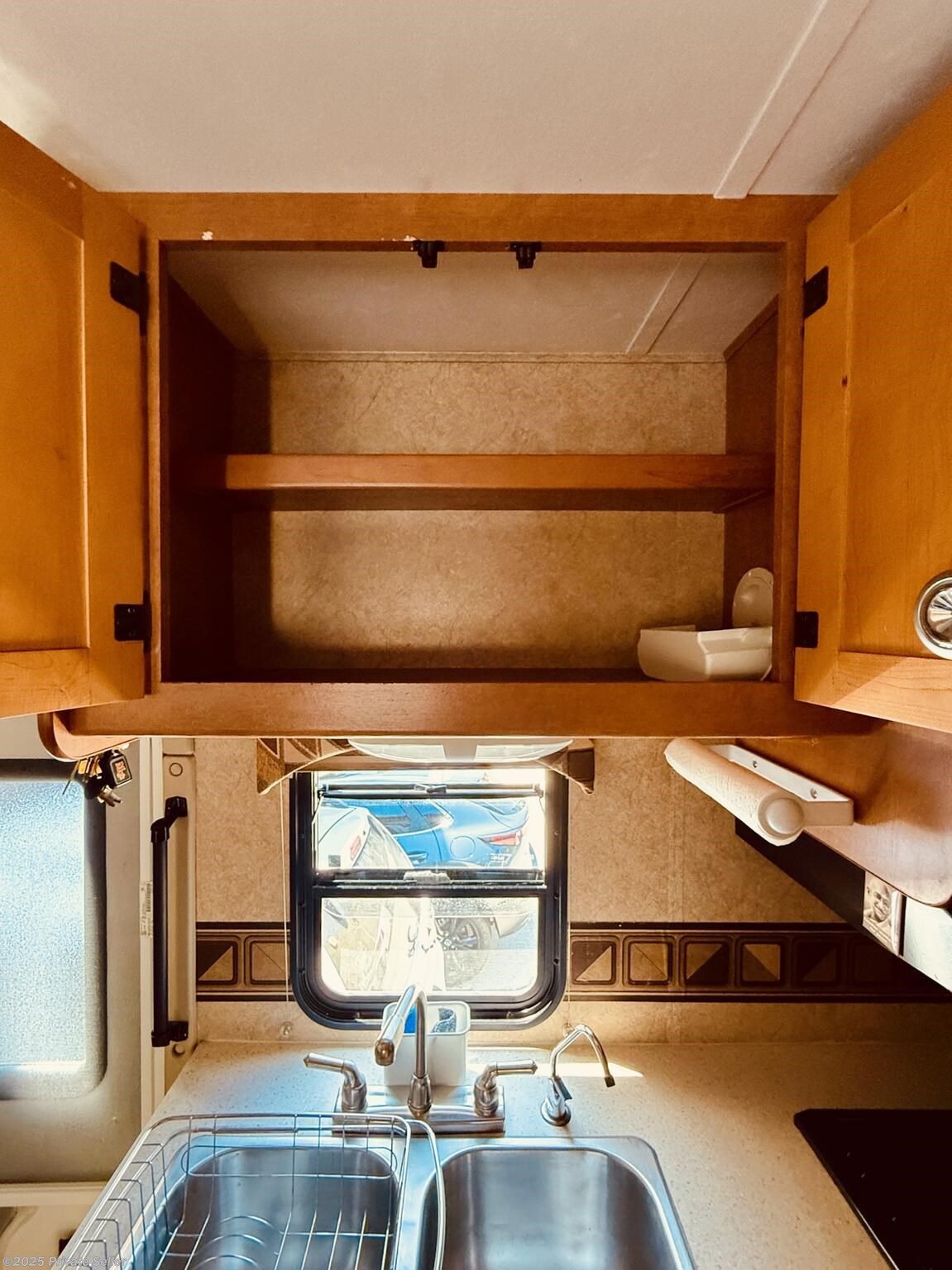 Double kitchen sink with ample pantry.