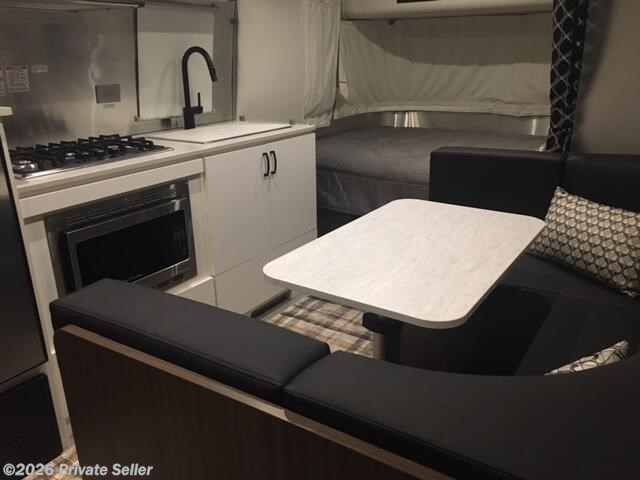 Black Cushion Dinette, Table retracts down to make another 2 person bed, 