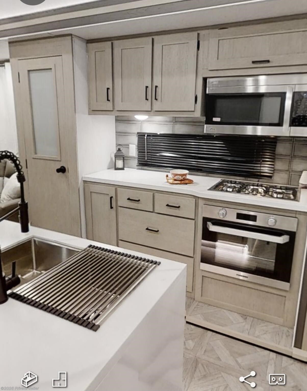 Looking at sink and kitchen 