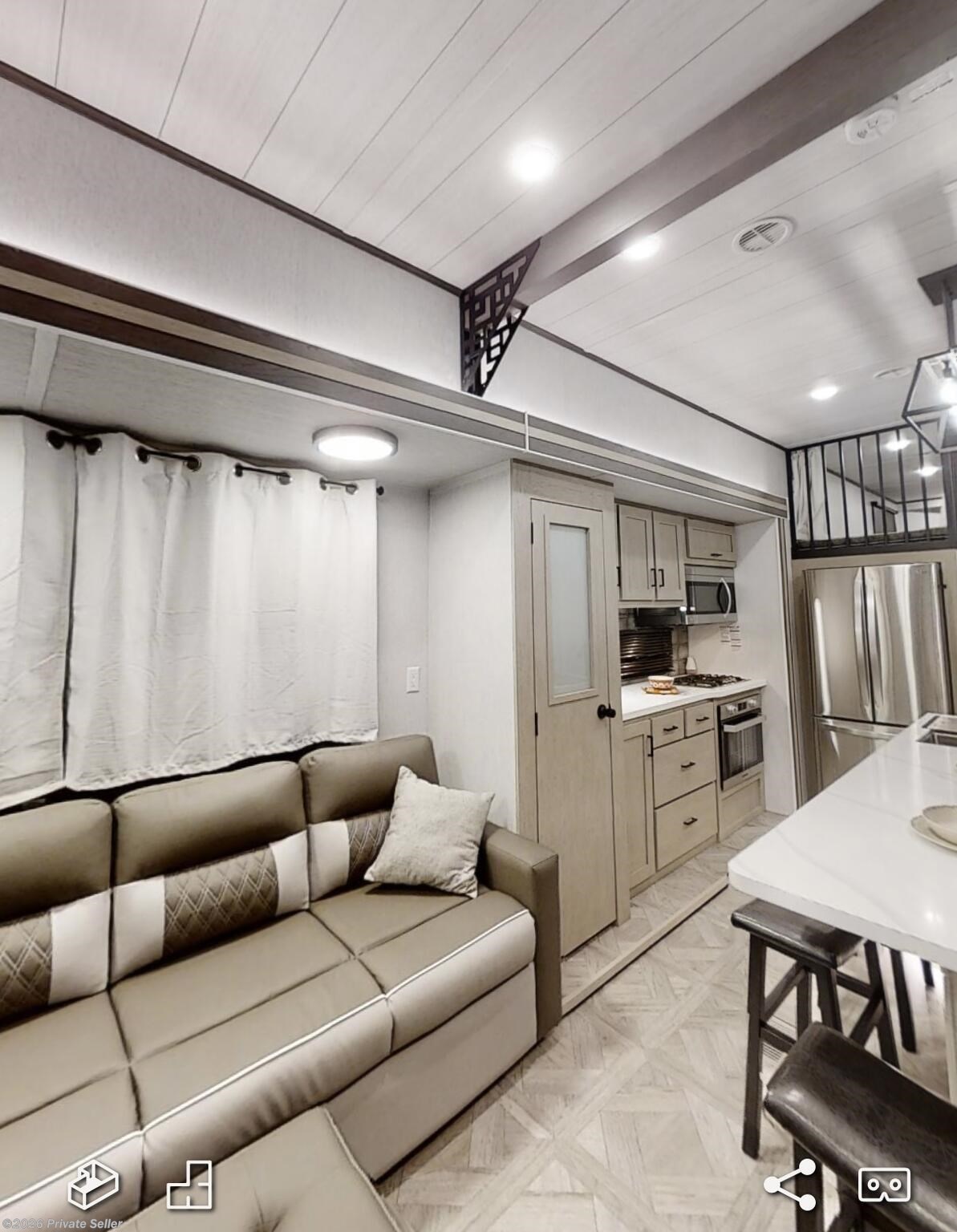 View of living room and kitchen. 