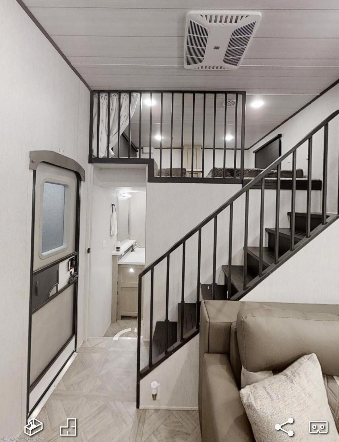 Looking at the back of unit in living room. The door is bathroom and another double lift upstairs bathroom 