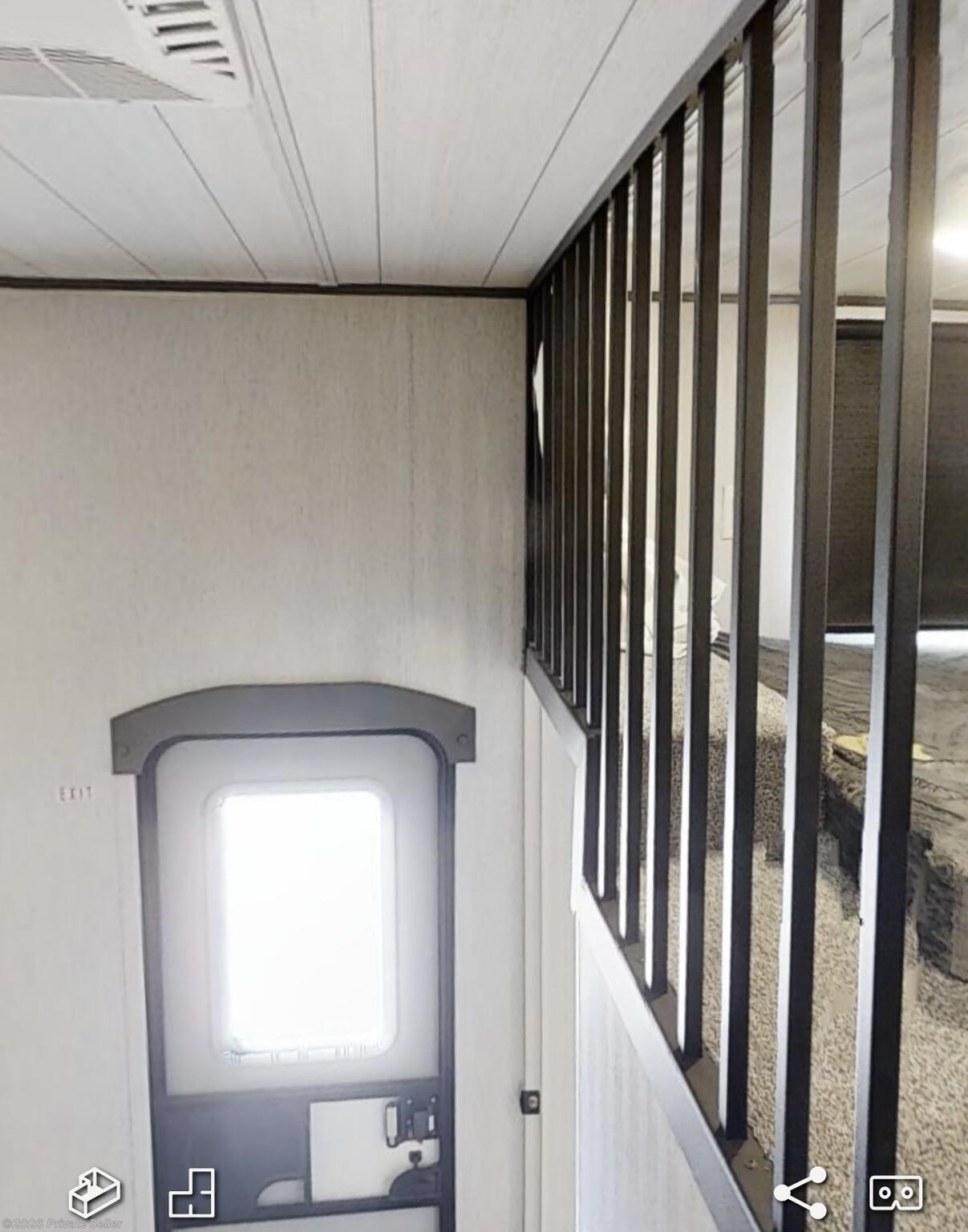 Looking down back lift stairs and out the back door 