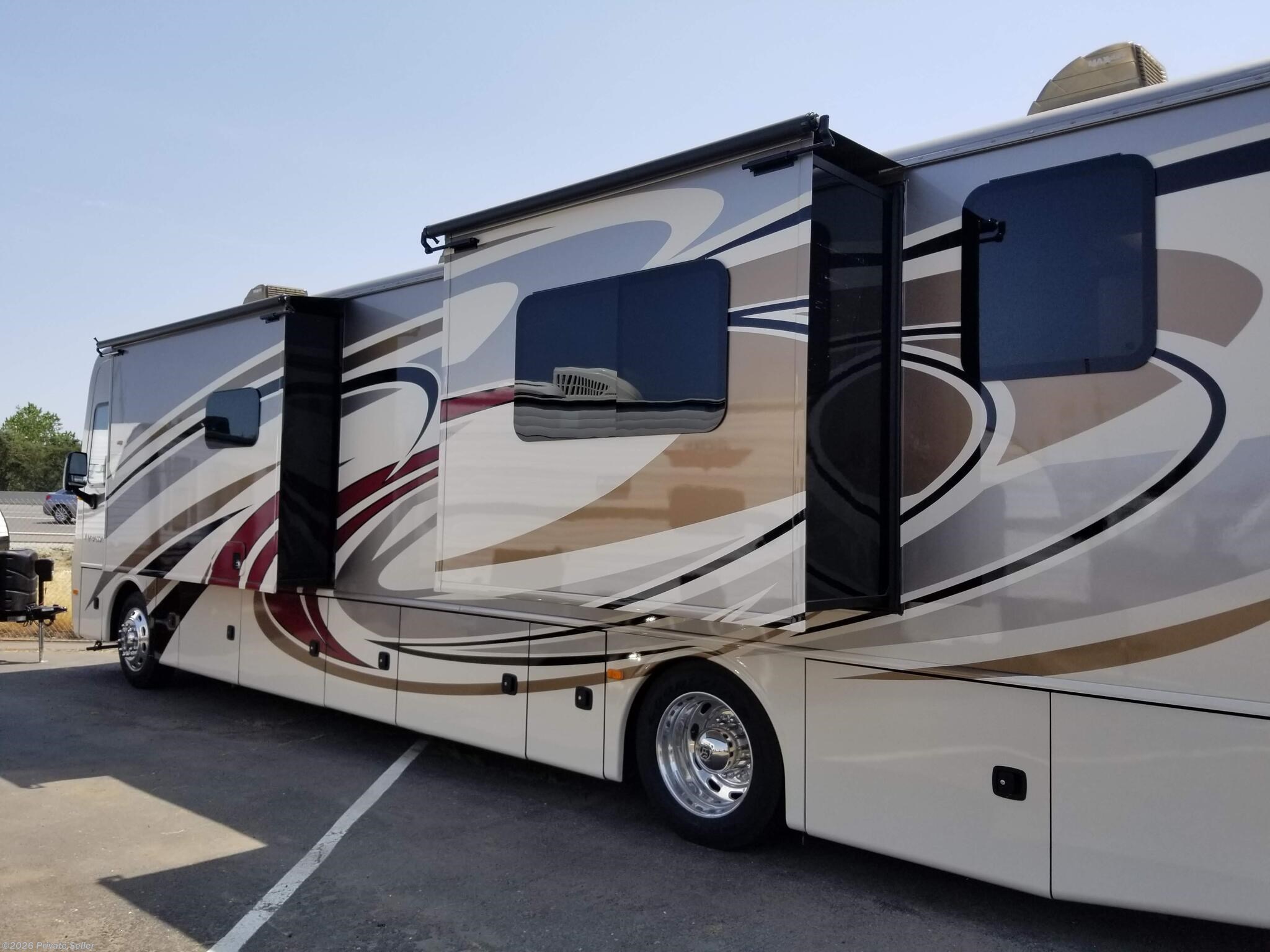 Driver's side of RV with both slides out for Kitchen and bedroom