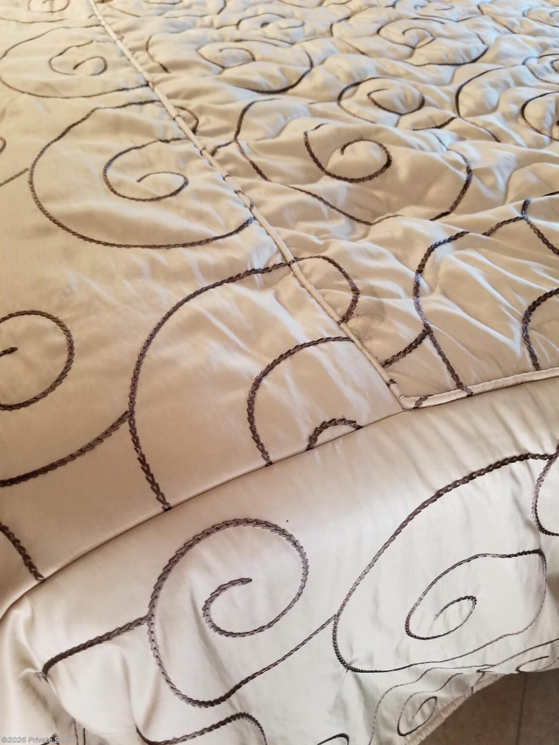 Bedspread pattern--to preserve original bedspread, It was removed and stored away and another spread was used.  New spread goes w/ coach.