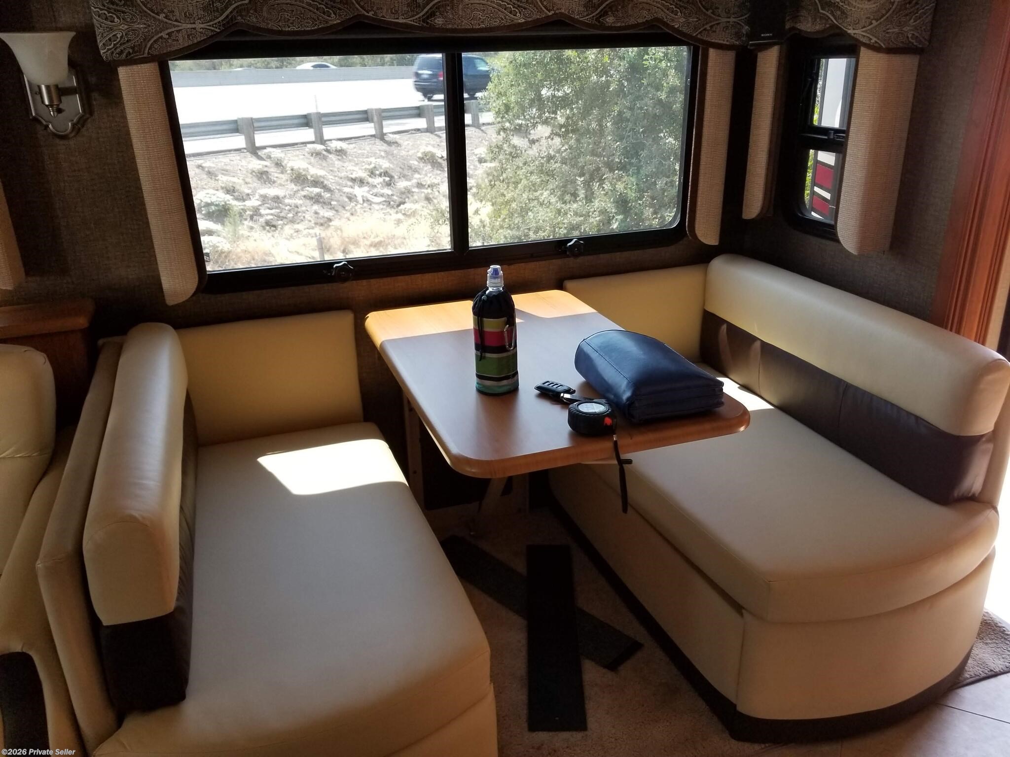 Full dinette w/ drop down table for optional bed.  Storage under benchs plus subwoofer