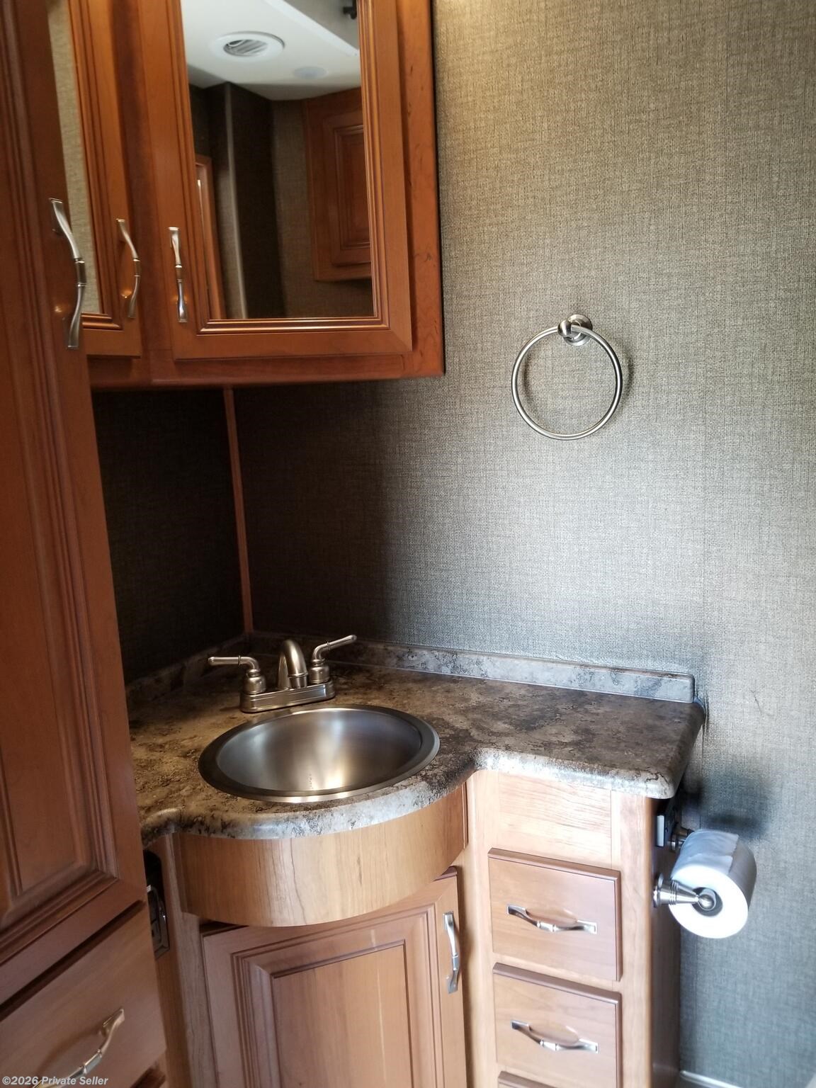 Mid Coach half bath.  Vanity over sink, storage below sink and drawers.  