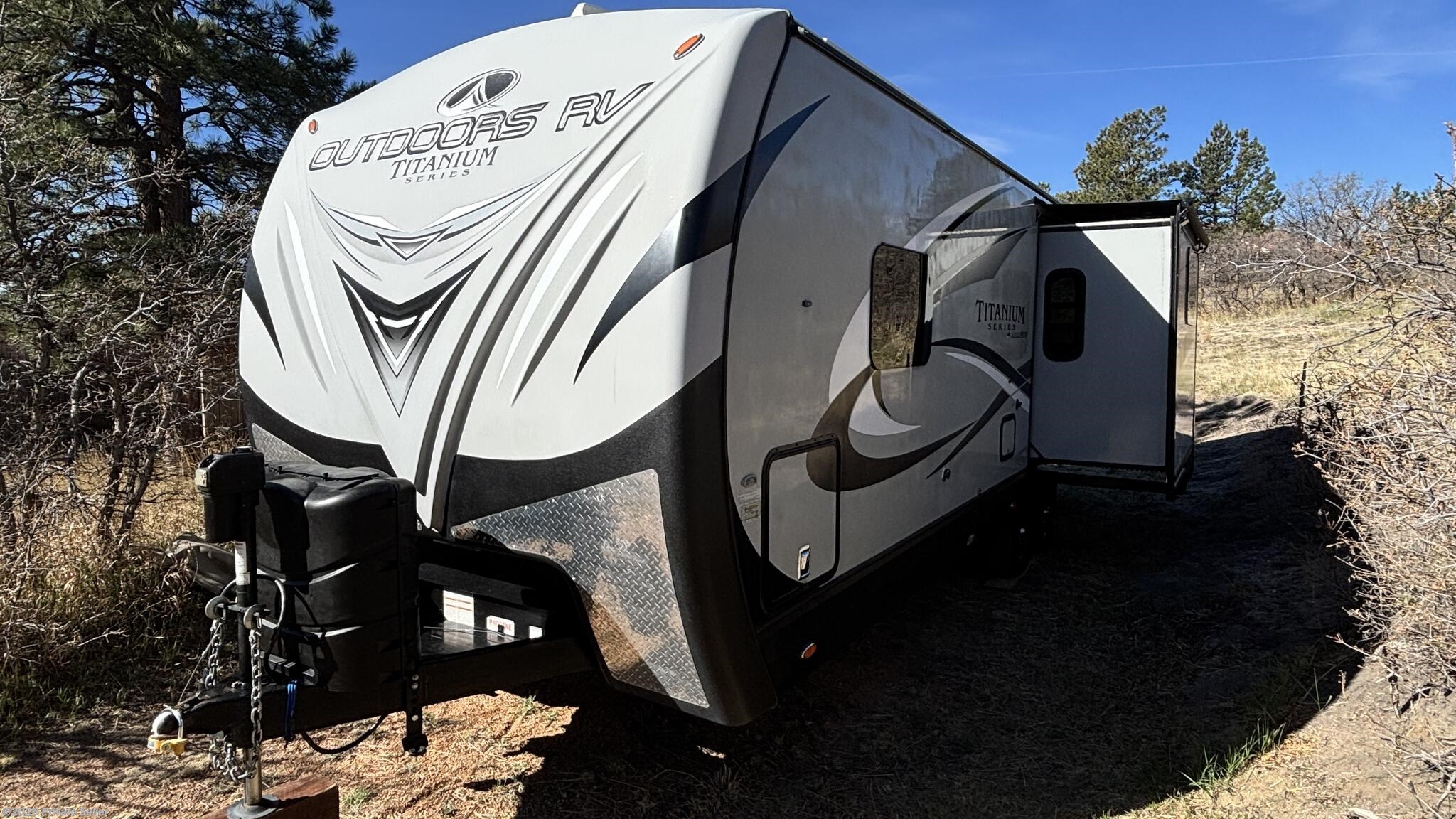 2020 Outdoors RV Timber Ridge 25RDS TITANIUM - Used Travel Trailer For Sale by For Sale By Owner in Colorado Springs, Colorado features Batteries, Microwave, Refrigerator (12V), Stove, Enclosed Water Tank