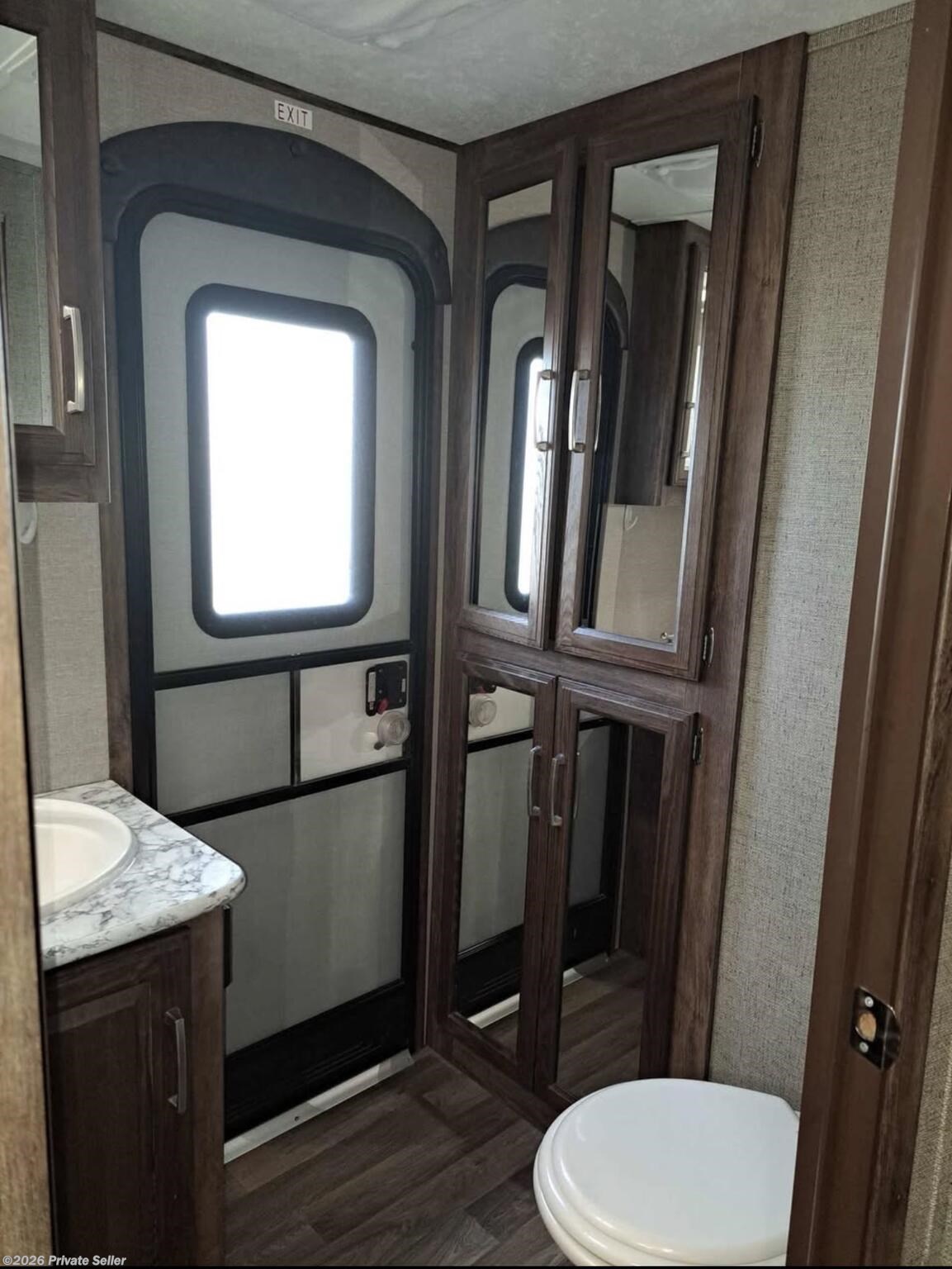 Mirrored medicine cabinet over sink, storage under sink, 4 mirrored cabinets with lots of room & porcelain toilet