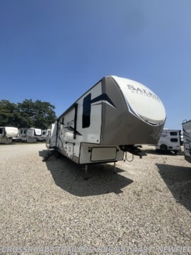 &lt;p style=&quot;text-align: center;&quot;&gt;&lt;span style=&quot;font-family: verdana, geneva, sans-serif; font-size: 14px;&quot;&gt;This absolutely stunning fifth wheel is the camper of your dreams and will make your next camping trip one for the books!! With a bedroom featuring a king size bed, bunkhouse, loft and a residential trifold sofa this trailer sleeps up to 10 people making it so you, your family and friends can enjoy this exciting experience. The fun doesn&#39;t stop inside as this trailer has an amazing outdoor kitchen with a refrigerator catering to all your cookout needs. In addition this trailer comes with:&amp;nbsp;&lt;/span&gt;&lt;/p&gt;
&lt;p style=&quot;text-align: center;&quot;&gt;&amp;nbsp;&lt;/p&gt;
&lt;ul style=&quot;--tw-translate-x: 0; --tw-translate-y: 0; --tw-rotate: 0; --tw-skew-x: 0; --tw-skew-y: 0; --tw-scale-x: 1; --tw-scale-y: 1; --tw-scroll-snap-strictness: proximity; --tw-ring-offset-width: 0px; --tw-ring-offset-color: #fff; --tw-ring-color: rgb(59 130 246 / .5); --tw-ring-offset-shadow: 0 0 #0000; --tw-ring-shadow: 0 0 #0000; --tw-shadow: 0 0 #0000; --tw-shadow-colored: 0 0 #0000; box-sizing: border-box; padding-left: 2rem; margin-top: 0px; margin-bottom: 0px; color: #212529; font-family: system-ui, -apple-system, &#39;Segoe UI&#39;, Roboto, &#39;Helvetica Neue&#39;, Arial, &#39;Noto Sans&#39;, &#39;Liberation Sans&#39;, sans-serif, &#39;Apple Color Emoji&#39;, &#39;Segoe UI Emoji&#39;, &#39;Segoe UI Symbol&#39;, &#39;Noto Color Emoji&#39;; font-size: 16px;&quot;&gt;
&lt;li style=&quot;--tw-translate-x: 0; --tw-translate-y: 0; --tw-rotate: 0; --tw-skew-x: 0; --tw-skew-y: 0; --tw-scale-x: 1; --tw-scale-y: 1; --tw-scroll-snap-strictness: proximity; --tw-ring-offset-width: 0px; --tw-ring-offset-color: #fff; --tw-ring-color: rgb(59 130 246 / .5); --tw-ring-offset-shadow: 0 0 #0000; --tw-ring-shadow: 0 0 #0000; --tw-shadow: 0 0 #0000; --tw-shadow-colored: 0 0 #0000; box-sizing: border-box;&quot;&gt;&lt;span style=&quot;font-family: verdana, geneva, sans-serif; font-size: 14px;&quot;&gt;30&quot; Deep Bed Slide Mech. Increased Floor Space!&lt;/span&gt;&lt;/li&gt;
&lt;li style=&quot;--tw-translate-x: 0; --tw-translate-y: 0; --tw-rotate: 0; --tw-skew-x: 0; --tw-skew-y: 0; --tw-scale-x: 1; --tw-scale-y: 1; --tw-scroll-snap-strictness: proximity; --tw-ring-offset-width: 0px; --tw-ring-offset-color: #fff; --tw-ring-color: rgb(59 130 246 / .5); --tw-ring-offset-shadow: 0 0 #0000; --tw-ring-shadow: 0 0 #0000; --tw-shadow: 0 0 #0000; --tw-shadow-colored: 0 0 #0000; box-sizing: border-box;&quot;&gt;&lt;span style=&quot;font-family: verdana, geneva, sans-serif; font-size: 14px;&quot;&gt;European Oak colored horizontal plank linoleum Flooring&lt;/span&gt;&lt;/li&gt;
&lt;li style=&quot;--tw-translate-x: 0; --tw-translate-y: 0; --tw-rotate: 0; --tw-skew-x: 0; --tw-skew-y: 0; --tw-scale-x: 1; --tw-scale-y: 1; --tw-scroll-snap-strictness: proximity; --tw-ring-offset-width: 0px; --tw-ring-offset-color: #fff; --tw-ring-color: rgb(59 130 246 / .5); --tw-ring-offset-shadow: 0 0 #0000; --tw-ring-shadow: 0 0 #0000; --tw-shadow: 0 0 #0000; --tw-shadow-colored: 0 0 #0000; box-sizing: border-box;&quot;&gt;&lt;span style=&quot;font-family: verdana, geneva, sans-serif; font-size: 14px;&quot;&gt;Saddle colored wood cabinetry with matte black Hardware&lt;/span&gt;&lt;/li&gt;
&lt;li style=&quot;--tw-translate-x: 0; --tw-translate-y: 0; --tw-rotate: 0; --tw-skew-x: 0; --tw-skew-y: 0; --tw-scale-x: 1; --tw-scale-y: 1; --tw-scroll-snap-strictness: proximity; --tw-ring-offset-width: 0px; --tw-ring-offset-color: #fff; --tw-ring-color: rgb(59 130 246 / .5); --tw-ring-offset-shadow: 0 0 #0000; --tw-ring-shadow: 0 0 #0000; --tw-shadow: 0 0 #0000; --tw-shadow-colored: 0 0 #0000; box-sizing: border-box;&quot;&gt;&lt;span style=&quot;font-family: verdana, geneva, sans-serif; font-size: 14px;&quot;&gt;12V Heat Pads on Holding Tanks&lt;/span&gt;&lt;/li&gt;
&lt;li style=&quot;--tw-translate-x: 0; --tw-translate-y: 0; --tw-rotate: 0; --tw-skew-x: 0; --tw-skew-y: 0; --tw-scale-x: 1; --tw-scale-y: 1; --tw-scroll-snap-strictness: proximity; --tw-ring-offset-width: 0px; --tw-ring-offset-color: #fff; --tw-ring-color: rgb(59 130 246 / .5); --tw-ring-offset-shadow: 0 0 #0000; --tw-ring-shadow: 0 0 #0000; --tw-shadow: 0 0 #0000; --tw-shadow-colored: 0 0 #0000; box-sizing: border-box;&quot;&gt;&lt;span style=&quot;font-family: verdana, geneva, sans-serif; font-size: 14px;&quot;&gt;Heated &amp;amp; Enclosed Dump Valves and Underbelly&lt;/span&gt;&lt;/li&gt;
&lt;li style=&quot;--tw-translate-x: 0; --tw-translate-y: 0; --tw-rotate: 0; --tw-skew-x: 0; --tw-skew-y: 0; --tw-scale-x: 1; --tw-scale-y: 1; --tw-scroll-snap-strictness: proximity; --tw-ring-offset-width: 0px; --tw-ring-offset-color: #fff; --tw-ring-color: rgb(59 130 246 / .5); --tw-ring-offset-shadow: 0 0 #0000; --tw-ring-shadow: 0 0 #0000; --tw-shadow: 0 0 #0000; --tw-shadow-colored: 0 0 #0000; box-sizing: border-box;&quot;&gt;&lt;span style=&quot;font-family: verdana, geneva, sans-serif; font-size: 14px;&quot;&gt;LED lit Theatre Seating with Recliners (Most Models)&lt;/span&gt;&lt;/li&gt;
&lt;li style=&quot;--tw-translate-x: 0; --tw-translate-y: 0; --tw-rotate: 0; --tw-skew-x: 0; --tw-skew-y: 0; --tw-scale-x: 1; --tw-scale-y: 1; --tw-scroll-snap-strictness: proximity; --tw-ring-offset-width: 0px; --tw-ring-offset-color: #fff; --tw-ring-color: rgb(59 130 246 / .5); --tw-ring-offset-shadow: 0 0 #0000; --tw-ring-shadow: 0 0 #0000; --tw-shadow: 0 0 #0000; --tw-shadow-colored: 0 0 #0000; box-sizing: border-box;&quot;&gt;&lt;span style=&quot;font-family: verdana, geneva, sans-serif; font-size: 14px;&quot;&gt;Versa Queen in Bunk Slides NEW Standard&lt;/span&gt;&lt;/li&gt;
&lt;li style=&quot;--tw-translate-x: 0; --tw-translate-y: 0; --tw-rotate: 0; --tw-skew-x: 0; --tw-skew-y: 0; --tw-scale-x: 1; --tw-scale-y: 1; --tw-scroll-snap-strictness: proximity; --tw-ring-offset-width: 0px; --tw-ring-offset-color: #fff; --tw-ring-color: rgb(59 130 246 / .5); --tw-ring-offset-shadow: 0 0 #0000; --tw-ring-shadow: 0 0 #0000; --tw-shadow: 0 0 #0000; --tw-shadow-colored: 0 0 #0000; box-sizing: border-box;&quot;&gt;&lt;span style=&quot;font-family: verdana, geneva, sans-serif; font-size: 14px;&quot;&gt;Full-Profile Front Cap with HUGE Functional Wardrobe&lt;/span&gt;&lt;/li&gt;
&lt;li style=&quot;--tw-translate-x: 0; --tw-translate-y: 0; --tw-rotate: 0; --tw-skew-x: 0; --tw-skew-y: 0; --tw-scale-x: 1; --tw-scale-y: 1; --tw-scroll-snap-strictness: proximity; --tw-ring-offset-width: 0px; --tw-ring-offset-color: #fff; --tw-ring-color: rgb(59 130 246 / .5); --tw-ring-offset-shadow: 0 0 #0000; --tw-ring-shadow: 0 0 #0000; --tw-shadow: 0 0 #0000; --tw-shadow-colored: 0 0 #0000; box-sizing: border-box;&quot;&gt;&lt;span style=&quot;font-family: verdana, geneva, sans-serif; font-size: 14px;&quot;&gt;Residential Tri-Fold Sofas&lt;/span&gt;&lt;/li&gt;
&lt;li style=&quot;--tw-translate-x: 0; --tw-translate-y: 0; --tw-rotate: 0; --tw-skew-x: 0; --tw-skew-y: 0; --tw-scale-x: 1; --tw-scale-y: 1; --tw-scroll-snap-strictness: proximity; --tw-ring-offset-width: 0px; --tw-ring-offset-color: #fff; --tw-ring-color: rgb(59 130 246 / .5); --tw-ring-offset-shadow: 0 0 #0000; --tw-ring-shadow: 0 0 #0000; --tw-shadow: 0 0 #0000; --tw-shadow-colored: 0 0 #0000; box-sizing: border-box;&quot;&gt;&lt;span style=&quot;font-family: verdana, geneva, sans-serif; font-size: 14px;&quot;&gt;Soft Close Hidden Hinges on Cabinet Doors&lt;/span&gt;&lt;/li&gt;
&lt;li style=&quot;--tw-translate-x: 0; --tw-translate-y: 0; --tw-rotate: 0; --tw-skew-x: 0; --tw-skew-y: 0; --tw-scale-x: 1; --tw-scale-y: 1; --tw-scroll-snap-strictness: proximity; --tw-ring-offset-width: 0px; --tw-ring-offset-color: #fff; --tw-ring-color: rgb(59 130 246 / .5); --tw-ring-offset-shadow: 0 0 #0000; --tw-ring-shadow: 0 0 #0000; --tw-shadow: 0 0 #0000; --tw-shadow-colored: 0 0 #0000; box-sizing: border-box;&quot;&gt;&lt;span style=&quot;font-family: verdana, geneva, sans-serif; font-size: 14px;&quot;&gt;Full Stand up Height 5th Wheel Bedrooms&lt;/span&gt;&lt;/li&gt;
&lt;li style=&quot;--tw-translate-x: 0; --tw-translate-y: 0; --tw-rotate: 0; --tw-skew-x: 0; --tw-skew-y: 0; --tw-scale-x: 1; --tw-scale-y: 1; --tw-scroll-snap-strictness: proximity; --tw-ring-offset-width: 0px; --tw-ring-offset-color: #fff; --tw-ring-color: rgb(59 130 246 / .5); --tw-ring-offset-shadow: 0 0 #0000; --tw-ring-shadow: 0 0 #0000; --tw-shadow: 0 0 #0000; --tw-shadow-colored: 0 0 #0000; box-sizing: border-box;&quot;&gt;&lt;span style=&quot;font-family: verdana, geneva, sans-serif; font-size: 14px;&quot;&gt;Vacuum Bonded &quot;Aluma Frame&quot; Sidewalls &amp;amp; Floor&lt;/span&gt;&lt;/li&gt;
&lt;li style=&quot;--tw-translate-x: 0; --tw-translate-y: 0; --tw-rotate: 0; --tw-skew-x: 0; --tw-skew-y: 0; --tw-scale-x: 1; --tw-scale-y: 1; --tw-scroll-snap-strictness: proximity; --tw-ring-offset-width: 0px; --tw-ring-offset-color: #fff; --tw-ring-color: rgb(59 130 246 / .5); --tw-ring-offset-shadow: 0 0 #0000; --tw-ring-shadow: 0 0 #0000; --tw-shadow: 0 0 #0000; --tw-shadow-colored: 0 0 #0000; box-sizing: border-box;&quot;&gt;&lt;span style=&quot;font-family: verdana, geneva, sans-serif; font-size: 14px;&quot;&gt;Outdoor Kitchen (295BH, 353BED, 356QB, 370BL)&lt;/span&gt;&lt;/li&gt;
&lt;li style=&quot;--tw-translate-x: 0; --tw-translate-y: 0; --tw-rotate: 0; --tw-skew-x: 0; --tw-skew-y: 0; --tw-scale-x: 1; --tw-scale-y: 1; --tw-scroll-snap-strictness: proximity; --tw-ring-offset-width: 0px; --tw-ring-offset-color: #fff; --tw-ring-color: rgb(59 130 246 / .5); --tw-ring-offset-shadow: 0 0 #0000; --tw-ring-shadow: 0 0 #0000; --tw-shadow: 0 0 #0000; --tw-shadow-colored: 0 0 #0000; box-sizing: border-box;&quot;&gt;&lt;span style=&quot;font-family: verdana, geneva, sans-serif; font-size: 14px;&quot;&gt;High Efficiency AC Cooling System&lt;/span&gt;&lt;/li&gt;
&lt;li style=&quot;--tw-translate-x: 0; --tw-translate-y: 0; --tw-rotate: 0; --tw-skew-x: 0; --tw-skew-y: 0; --tw-scale-x: 1; --tw-scale-y: 1; --tw-scroll-snap-strictness: proximity; --tw-ring-offset-width: 0px; --tw-ring-offset-color: #fff; --tw-ring-color: rgb(59 130 246 / .5); --tw-ring-offset-shadow: 0 0 #0000; --tw-ring-shadow: 0 0 #0000; --tw-shadow: 0 0 #0000; --tw-shadow-colored: 0 0 #0000; box-sizing: border-box;&quot;&gt;&lt;span style=&quot;font-family: verdana, geneva, sans-serif; font-size: 14px;&quot;&gt;Upgraded Insulation Package&lt;/span&gt;&lt;/li&gt;
&lt;li style=&quot;--tw-translate-x: 0; --tw-translate-y: 0; --tw-rotate: 0; --tw-skew-x: 0; --tw-skew-y: 0; --tw-scale-x: 1; --tw-scale-y: 1; --tw-scroll-snap-strictness: proximity; --tw-ring-offset-width: 0px; --tw-ring-offset-color: #fff; --tw-ring-color: rgb(59 130 246 / .5); --tw-ring-offset-shadow: 0 0 #0000; --tw-ring-shadow: 0 0 #0000; --tw-shadow: 0 0 #0000; --tw-shadow-colored: 0 0 #0000; box-sizing: border-box;&quot;&gt;&lt;span style=&quot;font-family: verdana, geneva, sans-serif; font-size: 14px;&quot;&gt;Extra Large Pass Thru Storage&lt;/span&gt;&lt;/li&gt;
&lt;li style=&quot;--tw-translate-x: 0; --tw-translate-y: 0; --tw-rotate: 0; --tw-skew-x: 0; --tw-skew-y: 0; --tw-scale-x: 1; --tw-scale-y: 1; --tw-scroll-snap-strictness: proximity; --tw-ring-offset-width: 0px; --tw-ring-offset-color: #fff; --tw-ring-color: rgb(59 130 246 / .5); --tw-ring-offset-shadow: 0 0 #0000; --tw-ring-shadow: 0 0 #0000; --tw-shadow: 0 0 #0000; --tw-shadow-colored: 0 0 #0000; box-sizing: border-box;&quot;&gt;&lt;span style=&quot;font-family: verdana, geneva, sans-serif; font-size: 14px;&quot;&gt;2&quot; Receiver Hitch For Storage Rack, etc. (N/A 356QB &amp;amp; 378FL)&lt;/span&gt;&lt;/li&gt;
&lt;li style=&quot;--tw-translate-x: 0; --tw-translate-y: 0; --tw-rotate: 0; --tw-skew-x: 0; --tw-skew-y: 0; --tw-scale-x: 1; --tw-scale-y: 1; --tw-scroll-snap-strictness: proximity; --tw-ring-offset-width: 0px; --tw-ring-offset-color: #fff; --tw-ring-color: rgb(59 130 246 / .5); --tw-ring-offset-shadow: 0 0 #0000; --tw-ring-shadow: 0 0 #0000; --tw-shadow: 0 0 #0000; --tw-shadow-colored: 0 0 #0000; box-sizing: border-box;&quot;&gt;&lt;span style=&quot;font-family: verdana, geneva, sans-serif; font-size: 14px;&quot;&gt;7-Way &quot;Rain Defense&quot; Plug Holder&lt;/span&gt;&lt;/li&gt;
&lt;li style=&quot;--tw-translate-x: 0; --tw-translate-y: 0; --tw-rotate: 0; --tw-skew-x: 0; --tw-skew-y: 0; --tw-scale-x: 1; --tw-scale-y: 1; --tw-scroll-snap-strictness: proximity; --tw-ring-offset-width: 0px; --tw-ring-offset-color: #fff; --tw-ring-color: rgb(59 130 246 / .5); --tw-ring-offset-shadow: 0 0 #0000; --tw-ring-shadow: 0 0 #0000; --tw-shadow: 0 0 #0000; --tw-shadow-colored: 0 0 #0000; box-sizing: border-box;&quot;&gt;&lt;span style=&quot;font-family: verdana, geneva, sans-serif; font-size: 14px;&quot;&gt;Shaded Pet Tether / Security Hook&lt;/span&gt;&lt;/li&gt;
&lt;li style=&quot;--tw-translate-x: 0; --tw-translate-y: 0; --tw-rotate: 0; --tw-skew-x: 0; --tw-skew-y: 0; --tw-scale-x: 1; --tw-scale-y: 1; --tw-scroll-snap-strictness: proximity; --tw-ring-offset-width: 0px; --tw-ring-offset-color: #fff; --tw-ring-color: rgb(59 130 246 / .5); --tw-ring-offset-shadow: 0 0 #0000; --tw-ring-shadow: 0 0 #0000; --tw-shadow: 0 0 #0000; --tw-shadow-colored: 0 0 #0000; box-sizing: border-box;&quot;&gt;&lt;span style=&quot;font-family: verdana, geneva, sans-serif; font-size: 14px;&quot;&gt;Side-Mounted Heat Ducts (Most All Locations)&lt;/span&gt;&lt;/li&gt;
&lt;li style=&quot;--tw-translate-x: 0; --tw-translate-y: 0; --tw-rotate: 0; --tw-skew-x: 0; --tw-skew-y: 0; --tw-scale-x: 1; --tw-scale-y: 1; --tw-scroll-snap-strictness: proximity; --tw-ring-offset-width: 0px; --tw-ring-offset-color: #fff; --tw-ring-color: rgb(59 130 246 / .5); --tw-ring-offset-shadow: 0 0 #0000; --tw-ring-shadow: 0 0 #0000; --tw-shadow: 0 0 #0000; --tw-shadow-colored: 0 0 #0000; box-sizing: border-box;&quot;&gt;&lt;span style=&quot;font-family: verdana, geneva, sans-serif; font-size: 14px;&quot;&gt;HUGE Underbed Storage&lt;/span&gt;&lt;/li&gt;
&lt;li style=&quot;--tw-translate-x: 0; --tw-translate-y: 0; --tw-rotate: 0; --tw-skew-x: 0; --tw-skew-y: 0; --tw-scale-x: 1; --tw-scale-y: 1; --tw-scroll-snap-strictness: proximity; --tw-ring-offset-width: 0px; --tw-ring-offset-color: #fff; --tw-ring-color: rgb(59 130 246 / .5); --tw-ring-offset-shadow: 0 0 #0000; --tw-ring-shadow: 0 0 #0000; --tw-shadow: 0 0 #0000; --tw-shadow-colored: 0 0 #0000; box-sizing: border-box;&quot;&gt;&lt;span style=&quot;font-family: verdana, geneva, sans-serif; font-size: 14px;&quot;&gt;Mini-Max Electric Fan in All Bathrooms&lt;/span&gt;&lt;/li&gt;
&lt;li style=&quot;--tw-translate-x: 0; --tw-translate-y: 0; --tw-rotate: 0; --tw-skew-x: 0; --tw-skew-y: 0; --tw-scale-x: 1; --tw-scale-y: 1; --tw-scroll-snap-strictness: proximity; --tw-ring-offset-width: 0px; --tw-ring-offset-color: #fff; --tw-ring-color: rgb(59 130 246 / .5); --tw-ring-offset-shadow: 0 0 #0000; --tw-ring-shadow: 0 0 #0000; --tw-shadow: 0 0 #0000; --tw-shadow-colored: 0 0 #0000; box-sizing: border-box;&quot;&gt;&lt;span style=&quot;font-family: verdana, geneva, sans-serif; font-size: 14px;&quot;&gt;Exterior Bottle Opener&lt;/span&gt;&lt;/li&gt;
&lt;li style=&quot;--tw-translate-x: 0; --tw-translate-y: 0; --tw-rotate: 0; --tw-skew-x: 0; --tw-skew-y: 0; --tw-scale-x: 1; --tw-scale-y: 1; --tw-scroll-snap-strictness: proximity; --tw-ring-offset-width: 0px; --tw-ring-offset-color: #fff; --tw-ring-color: rgb(59 130 246 / .5); --tw-ring-offset-shadow: 0 0 #0000; --tw-ring-shadow: 0 0 #0000; --tw-shadow: 0 0 #0000; --tw-shadow-colored: 0 0 #0000; box-sizing: border-box;&quot;&gt;&lt;span style=&quot;font-family: verdana, geneva, sans-serif; font-size: 14px;&quot;&gt;Radial Tires w/ Black-Accented Aluminum Rims&lt;/span&gt;&lt;/li&gt;
&lt;li style=&quot;--tw-translate-x: 0; --tw-translate-y: 0; --tw-rotate: 0; --tw-skew-x: 0; --tw-skew-y: 0; --tw-scale-x: 1; --tw-scale-y: 1; --tw-scroll-snap-strictness: proximity; --tw-ring-offset-width: 0px; --tw-ring-offset-color: #fff; --tw-ring-color: rgb(59 130 246 / .5); --tw-ring-offset-shadow: 0 0 #0000; --tw-ring-shadow: 0 0 #0000; --tw-shadow: 0 0 #0000; --tw-shadow-colored: 0 0 #0000; box-sizing: border-box;&quot;&gt;&lt;span style=&quot;font-family: verdana, geneva, sans-serif; font-size: 14px;&quot;&gt;Designer&#39;s Choice Comforter &amp;amp; Bed-slide accent wall&lt;/span&gt;&lt;/li&gt;
&lt;/ul&gt;
&lt;ul style=&quot;--tw-translate-x: 0; --tw-translate-y: 0; --tw-rotate: 0; --tw-skew-x: 0; --tw-skew-y: 0; --tw-scale-x: 1; --tw-scale-y: 1; --tw-scroll-snap-strictness: proximity; --tw-ring-offset-width: 0px; --tw-ring-offset-color: #fff; --tw-ring-color: rgb(59 130 246 / .5); --tw-ring-offset-shadow: 0 0 #0000; --tw-ring-shadow: 0 0 #0000; --tw-shadow: 0 0 #0000; --tw-shadow-colored: 0 0 #0000; box-sizing: border-box; padding-left: 2rem; margin-top: 0px; margin-bottom: 0px; color: #212529; font-family: system-ui, -apple-system, &#39;Segoe UI&#39;, Roboto, &#39;Helvetica Neue&#39;, Arial, &#39;Noto Sans&#39;, &#39;Liberation Sans&#39;, sans-serif, &#39;Apple Color Emoji&#39;, &#39;Segoe UI Emoji&#39;, &#39;Segoe UI Symbol&#39;, &#39;Noto Color Emoji&#39;; font-size: 16px; text-align: center;&quot;&gt;Along with many many more for more information give us a call at 856-697-4497 or email us at sales.crossroadstrailers.com&amp;nbsp;&lt;/ul&gt;
