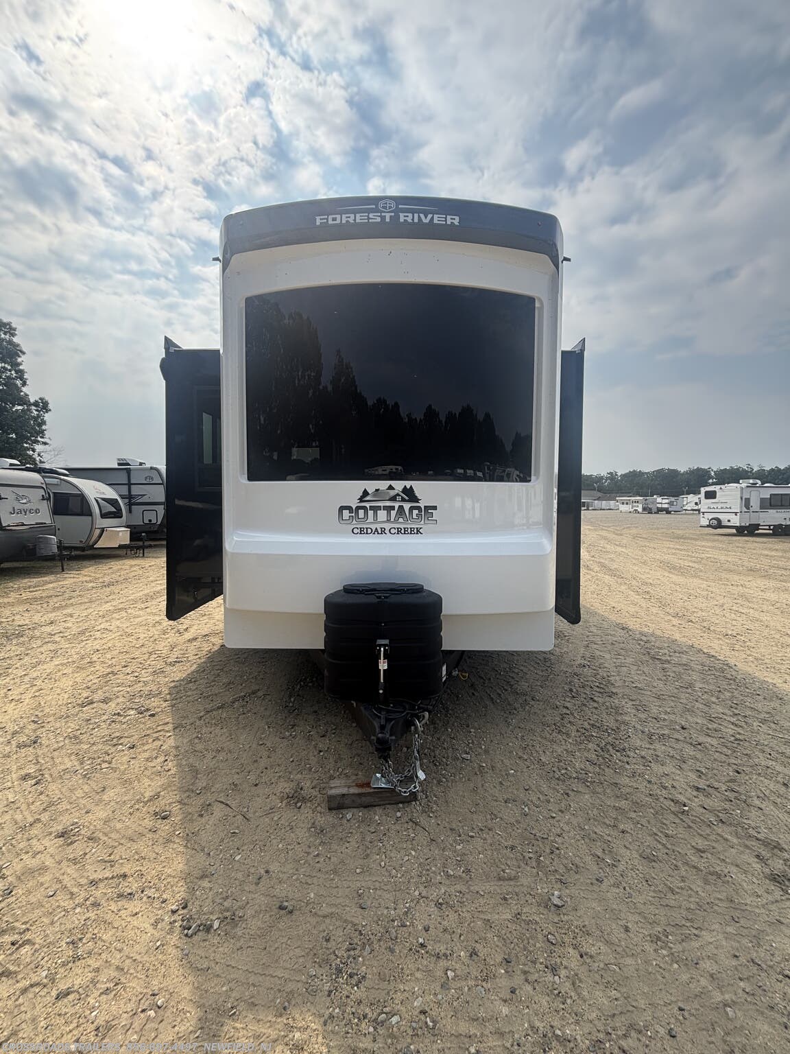 2027 Forest River Cedar Creek Cottage 40CDL - New Destination Trailer For Sale by Crossroads Trailer Sales, Inc. in Newfield, New Jersey features Pantry, Ceiling Fan, Fireplace, Water Heater, Dryer