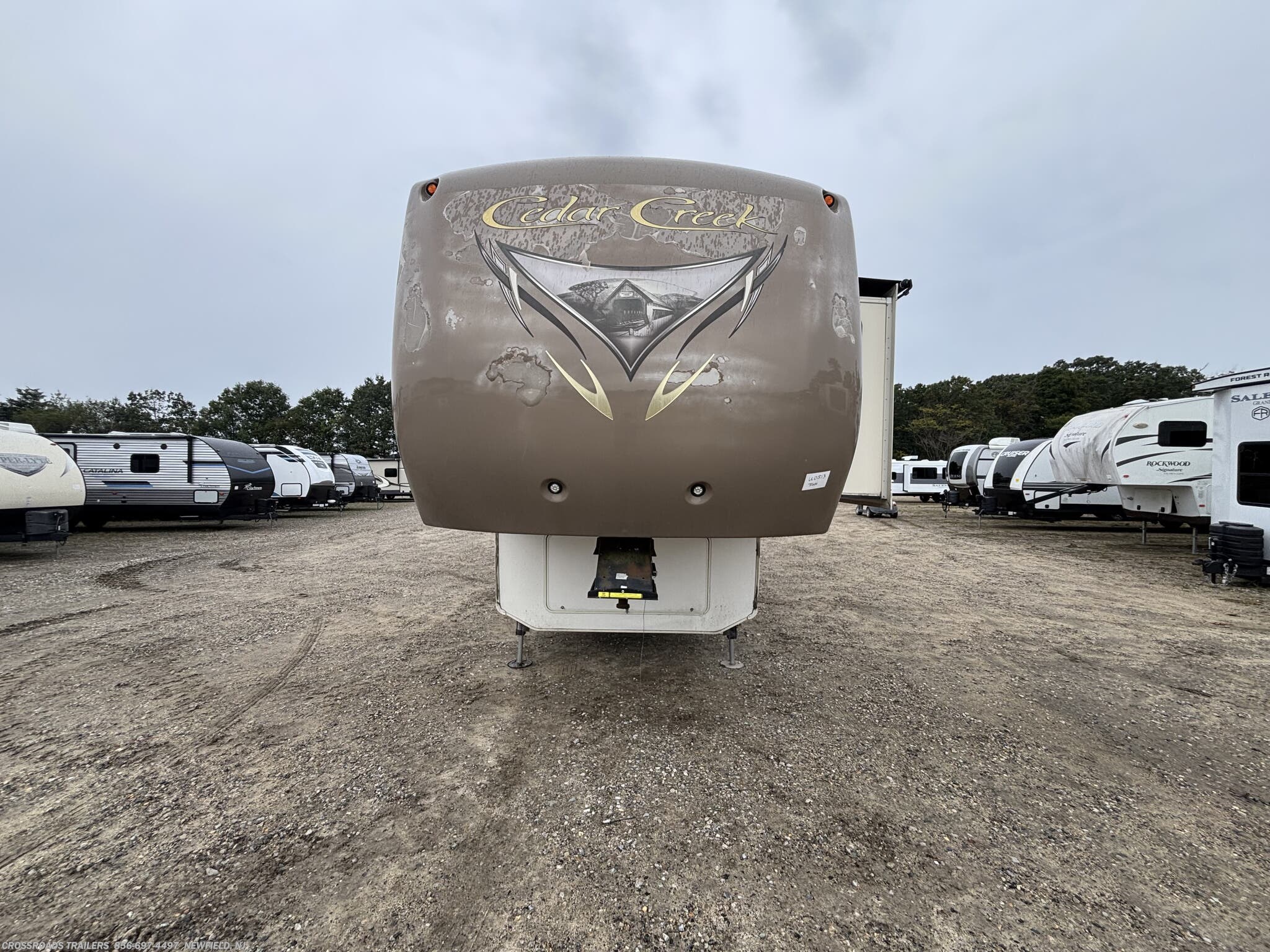 2014 Forest River Cedar Creek 36CKTS - Used Fifth Wheel For Sale by Crossroads Trailer Sales, Inc. in Newfield, New Jersey features Converter, Oven, Roof Vent, Refrigerator, 50 Amp Service