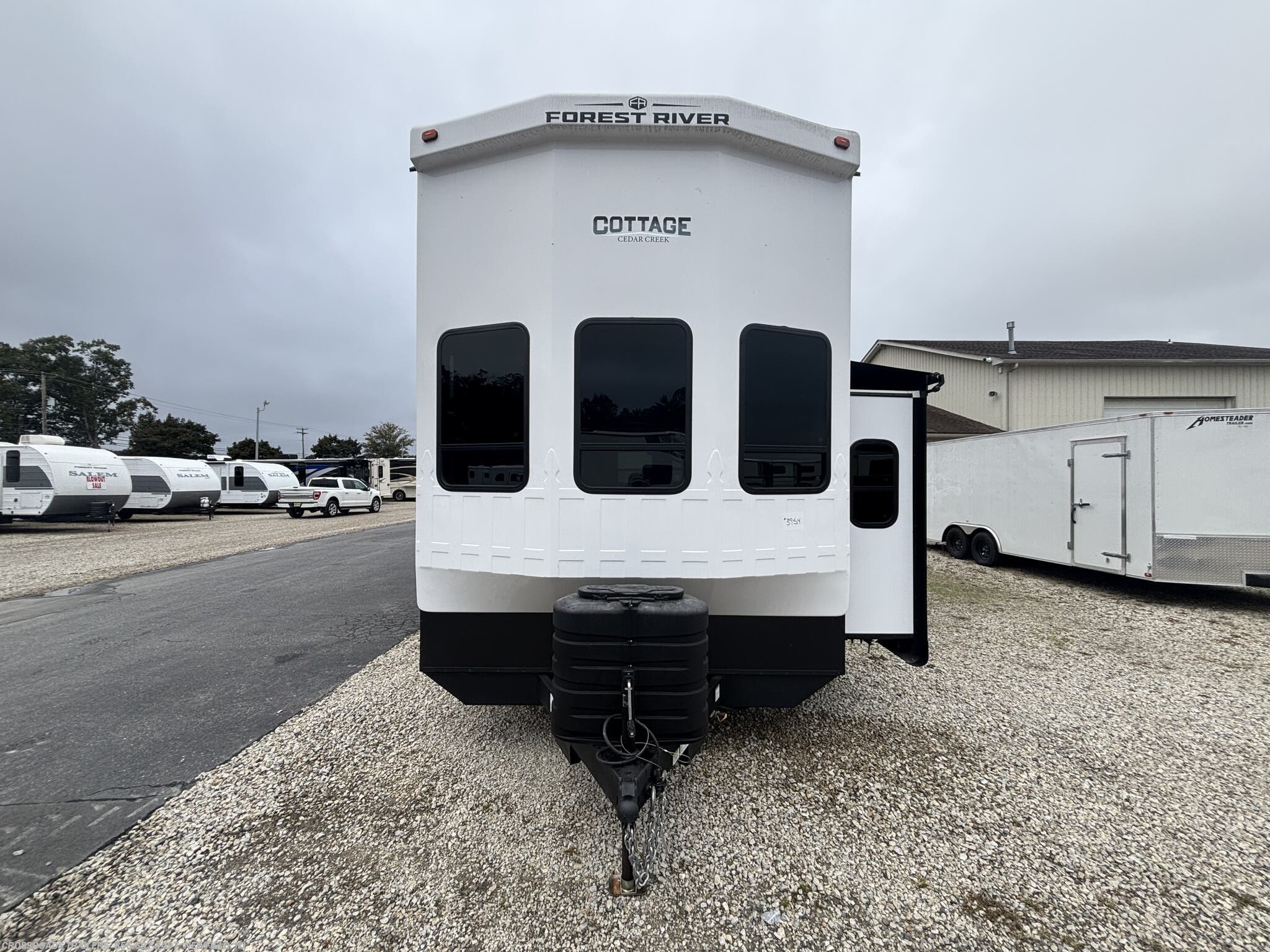 2025 Forest River Cedar Creek Cottage 40CBK - Used Destination Trailer For Sale by Crossroads Trailer Sales, Inc. in Newfield, New Jersey features Air Conditioning, Shower, Stove Top Burner, Batteries, Furnace